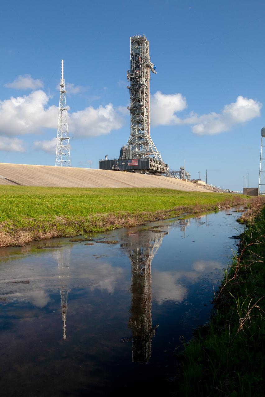 The mobile launcher for Artemis missions is at Launch Pad 39B on Sept. 11, 2019, at NASA’s Kennedy Space Center in Florida, after spending a week and a half inside the Vehicle Assembly Building (VAB) due to the approach of Hurricane Dorian. The nearly 400-foot-tall structure was moved from Launch Pad 39B to the VAB for safekeeping on Aug. 30. The storm passed about 70 miles east of the spaceport during the overnight hours Tuesday, Sept. 3, and Wednesday, Sept. 4. NASA’s Exploration Ground Systems moved the mobile launcher back to the launch pad, where teams will complete testing and checkout on the launcher in the coming weeks for the Artemis I mission.