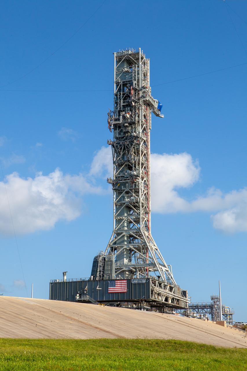The mobile launcher for Artemis missions is at Launch Pad 39B on Sept. 11, 2019, at NASA’s Kennedy Space Center in Florida, after spending a week and a half inside the Vehicle Assembly Building (VAB) due to the approach of Hurricane Dorian. The nearly 400-foot-tall structure was moved from Launch Pad 39B to the VAB for safekeeping on Aug. 30. The storm passed about 70 miles east of the spaceport during the overnight hours Tuesday, Sept. 3, and Wednesday, Sept. 4. NASA’s Exploration Ground Systems moved the mobile launcher back to the launch pad, where teams will complete testing and checkout on the launcher in the coming weeks for the Artemis I mission.