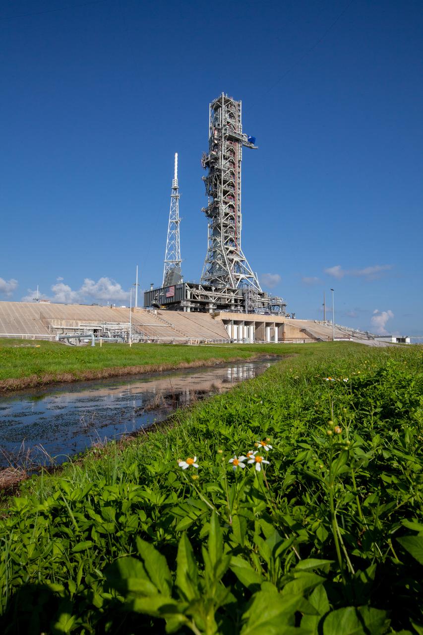The mobile launcher for Artemis missions is at Launch Pad 39B on Sept. 11, 2019, at NASA’s Kennedy Space Center in Florida, after spending a week and a half inside the Vehicle Assembly Building (VAB) due to the approach of Hurricane Dorian. The nearly 400-foot-tall structure was moved from Launch Pad 39B to the VAB for safekeeping on Aug. 30. The storm passed about 70 miles east of the spaceport during the overnight hours Tuesday, Sept. 3, and Wednesday, Sept. 4. NASA’s Exploration Ground Systems moved the mobile launcher back to the launch pad, where teams will complete testing and checkout on the launcher in the coming weeks for the Artemis I mission.