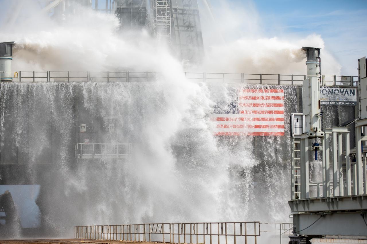 A wet flow test at Launch Pad 39B on September 13, 2019, tests the sound suppression system that will be used for launch of NASA’s Space Launch System for the Artemis I mission. During the test, about 450,000 gallons of water poured onto the Pad B flame deflector, the mobile launcher flame hole and onto the launcher’s blast deck. This was the first time the ground launch sequencer that will be used on the day of launch was used for the timing of a sound suppression test.