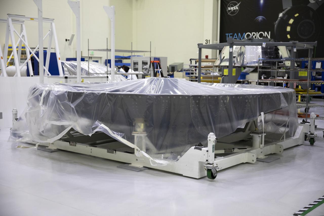 The heat shield for Orion’s Artemis ll, NASA’s first crewed mission, is inside the Neil Armstrong Operations and Checkout Building high bay at the agency’s Kennedy Space Center in Florida on Sept. 17, 2019. The heat shield, measuring roughly 16 feet in diameter, will protect astronauts upon re-entry. The heat shield is a base titanium truss structure. Technicians will apply Avcoat, an ablative material that will provide the thermal protection needed to withstand the harsh environment of space and during re-entry. Artemis ll will confirm all of the spacecraft’s systems operate as designed in the actual environment of deep space with astronauts aboard.