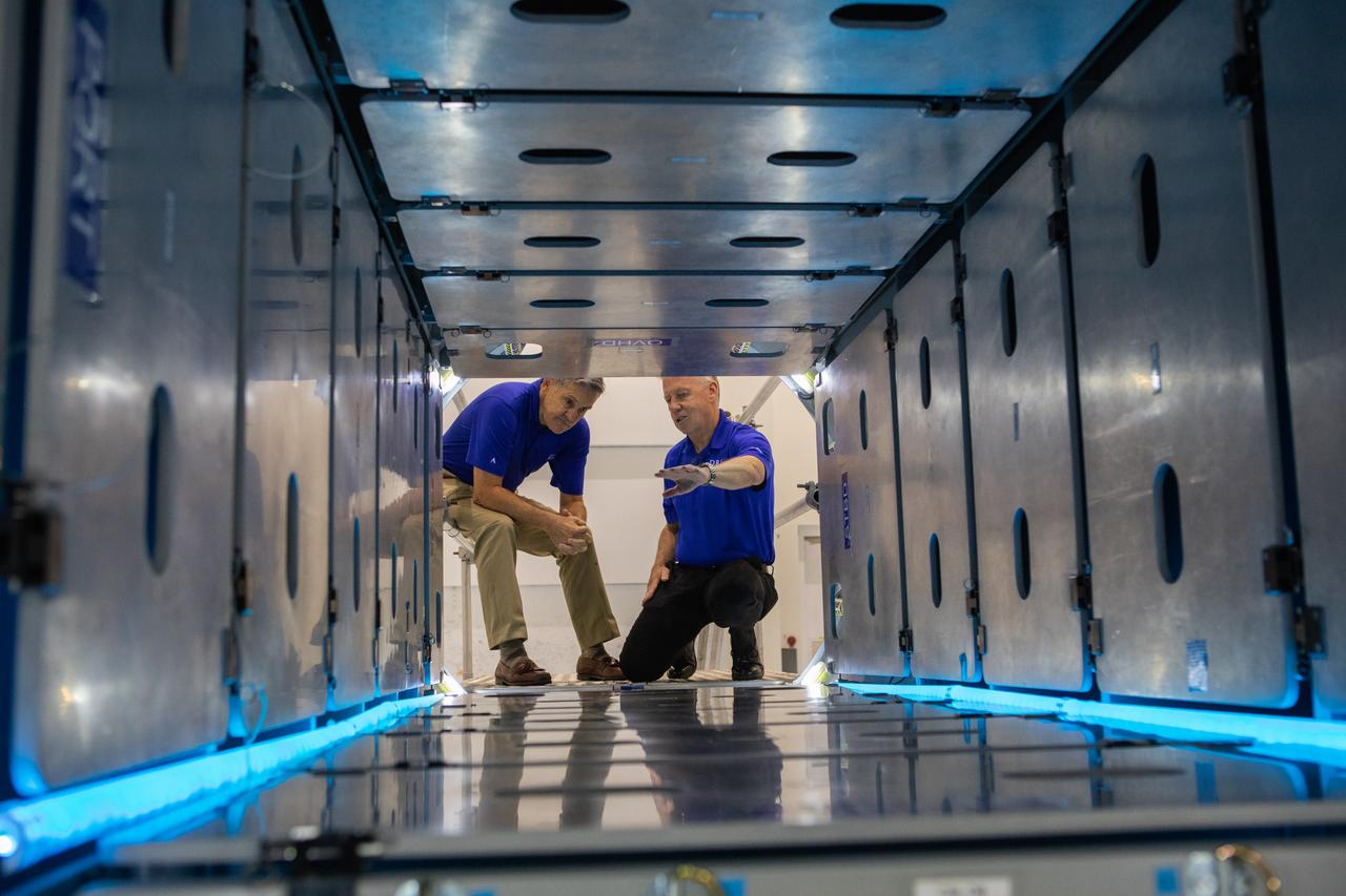 A mockup of the cargo logistics module for Sierra Nevada Corporation’s Dream Chaser, the company’s reusable spaceplane, arrived at the Space Station Processing Facility (SSPF) at NASA’s Kennedy Space Center in Florida in August. On Sept. 20, 2019, senior leadership had the opportunity to view the cargo module in the SSPF high bay. Kennedy Center Director Bob Cabana, views the interior of the cargo module with Steve Lindsey, vice president, Space Exploration Systems, Sierra Nevada Corporation. The SSPF is providing support for current and future NASA and commercial provider programs, including Commercial Resupply Services, Artemis 1, sending the first woman and next man to the Moon, and deep space destinations including Mars.