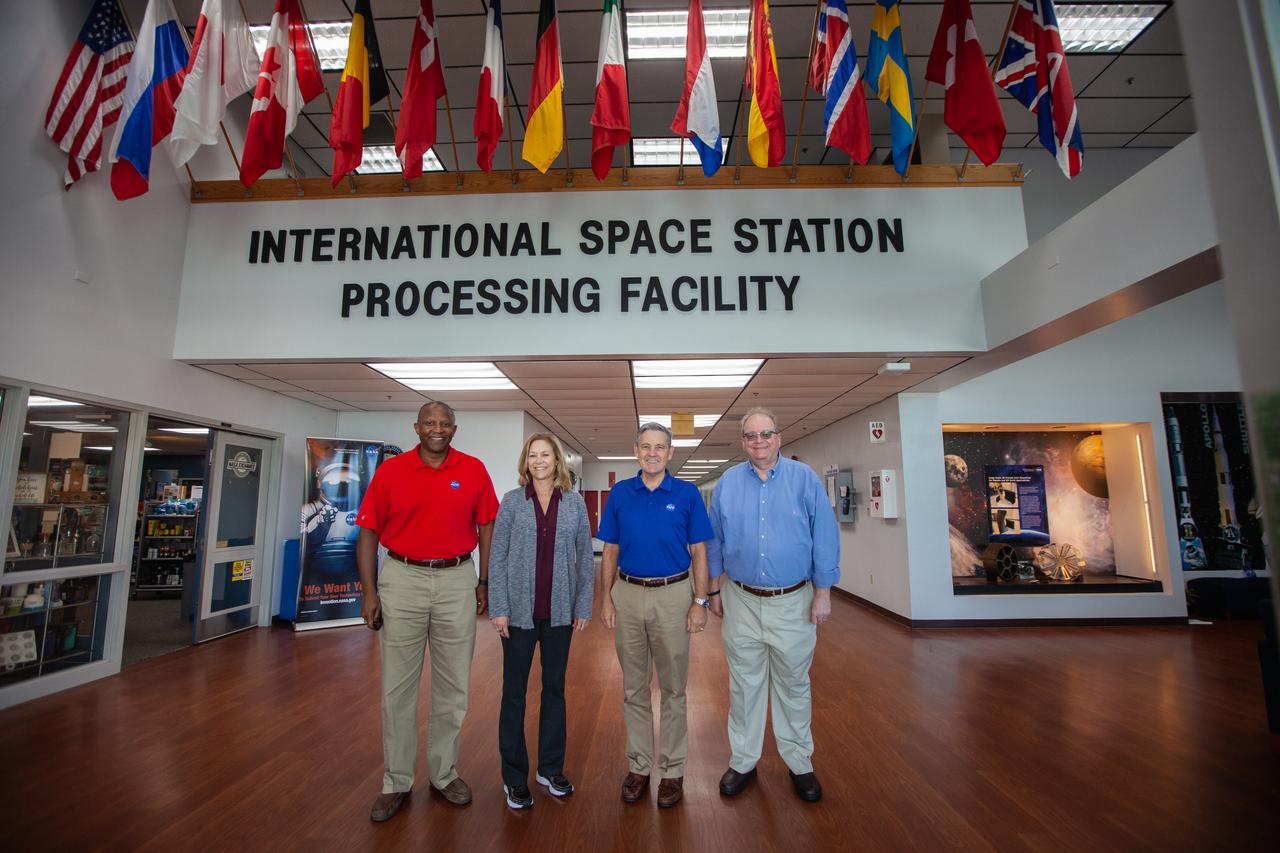A mockup of the cargo logistics module for Sierra Nevada Corporation’s Dream Chaser, the company’s reusable spaceplane, arrived at the Space Station Processing Facility (SSPF) at NASA’s Kennedy Space Center in Florida in August. On Sept. 20, 2019, senior leadership had the opportunity to view the cargo module in the SSPF high bay. From left, are Kelvin Manning, Kennedy associate director, technical; Kennedy Deputy Director Janet Petro; Kennedy Center Director Bob Cabana; and Burt Summerfield, Kennedy associate director, management. The SSPF is providing support for current and future NASA and commercial provider programs, including Commercial Resupply Services, Artemis 1, sending the first woman and next man to the Moon, and deep space destinations including Mars.