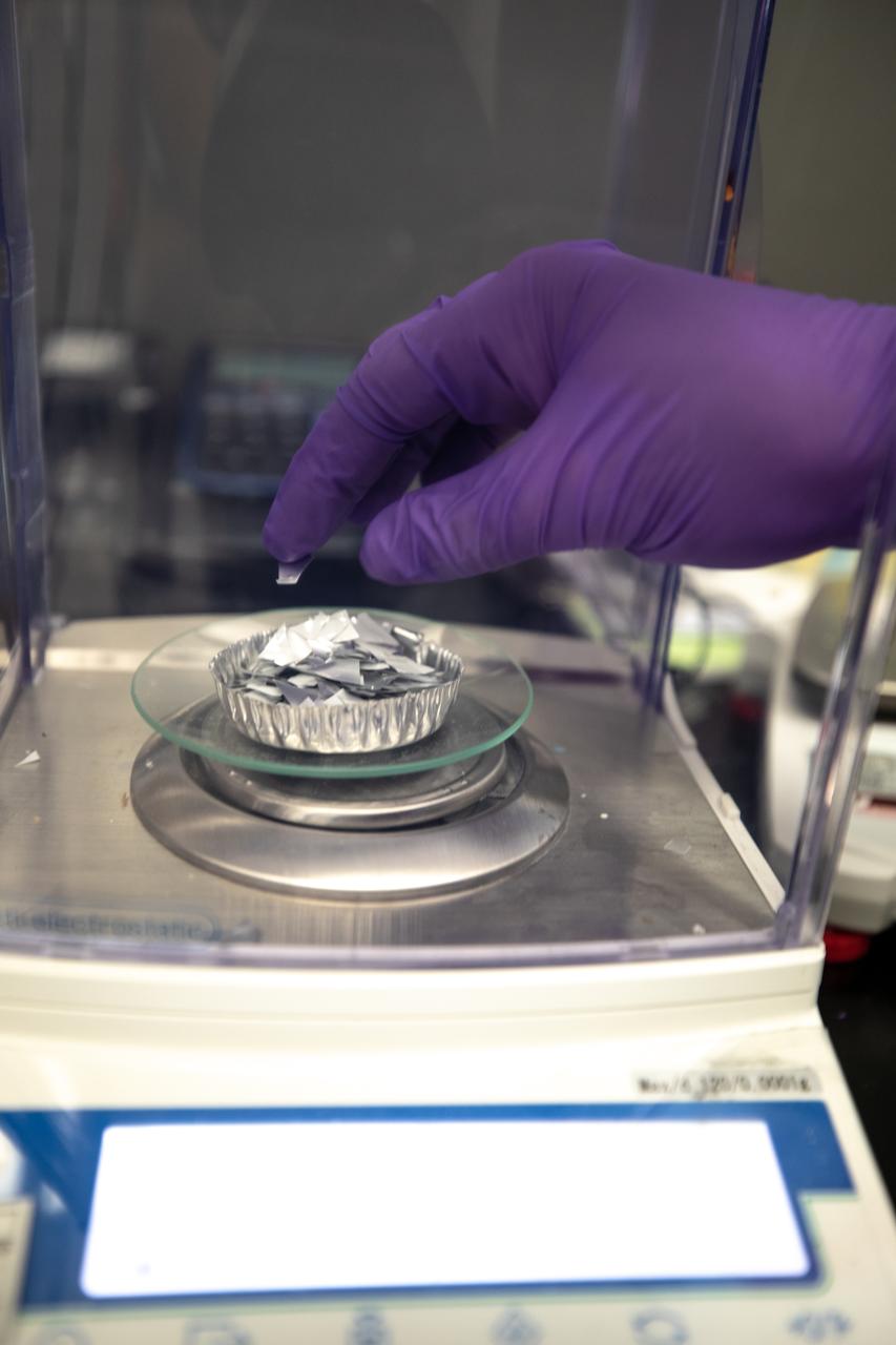 A Kennedy Space Center intern weighs trash simulant – comprised of different types of material that have been cut into tiny pieces – that will be utilized for the agency’s Orbital Syngas Commodity Augmentation Reactor, or OSCAR. OSCAR is an Early Career Initiative project at the Florida spaceport that studies technology to convert trash and human waste into useful gasses such as methane, hydrogen and carbon dioxide. By processing small pieces of trash in a high-temperature reactor, OSCAR is advancing new and innovative technology for managing waste in space. OSCAR would reduce the amount of space needed for waste storage within a spacecraft, turn some waste into gasses that have energy storage and life support applications, and ensure waste is no longer biologically active. A prototype has been developed, and a team of Kennedy employees are in the process of constructing a new rig for suborbital flight testing. 