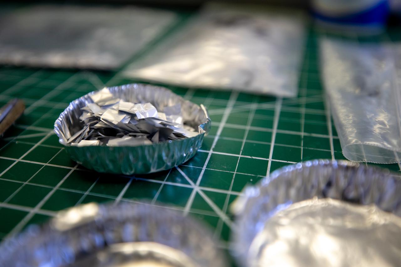 Pictured at Kennedy Space Center is trash simulant – comprised of different types of material that have been cut into tiny pieces – that will be utilized for NASA’s Orbital Syngas Commodity Augmentation Reactor, or OSCAR. OSCAR is an Early Career Initiative project at the Florida spaceport that studies technology to convert trash and human waste into useful gasses such as methane, hydrogen and carbon dioxide. By processing small pieces of trash in a high-temperature reactor, OSCAR is advancing new and innovative technology for managing waste in space. OSCAR would reduce the amount of space needed for waste storage within a spacecraft, turn some waste into gasses that have energy storage and life support applications, and ensure waste is no longer biologically active. A prototype has been developed, and a team of Kennedy employees are in the process of constructing a new rig for suborbital flight testing.