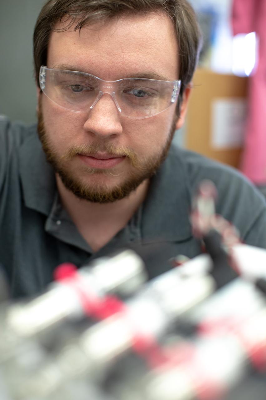 Jonathan Gleeson, Kennedy Space Center employee providing support for NASA’s Orbital Syngas Commodity Augmentation Reactor (OSCAR) under the center’s Laboratory Support Services and Operations contract, assembles the flight hardware of OSCAR. OSCAR is an Early Career Initiative project at the Florida spaceport that studies technology to convert trash and human waste into useful gasses such as methane, hydrogen and carbon dioxide. By processing small pieces of trash in a high-temperature reactor, OSCAR is advancing new and innovative technology for managing waste in space. OSCAR would reduce the amount of space needed for waste storage within a spacecraft, turn some waste into gasses that have energy storage and life support applications, and ensure waste is no longer biologically active. A prototype has been developed, and a team of Kennedy employees are in the process of constructing a new rig for suborbital flight testing. 