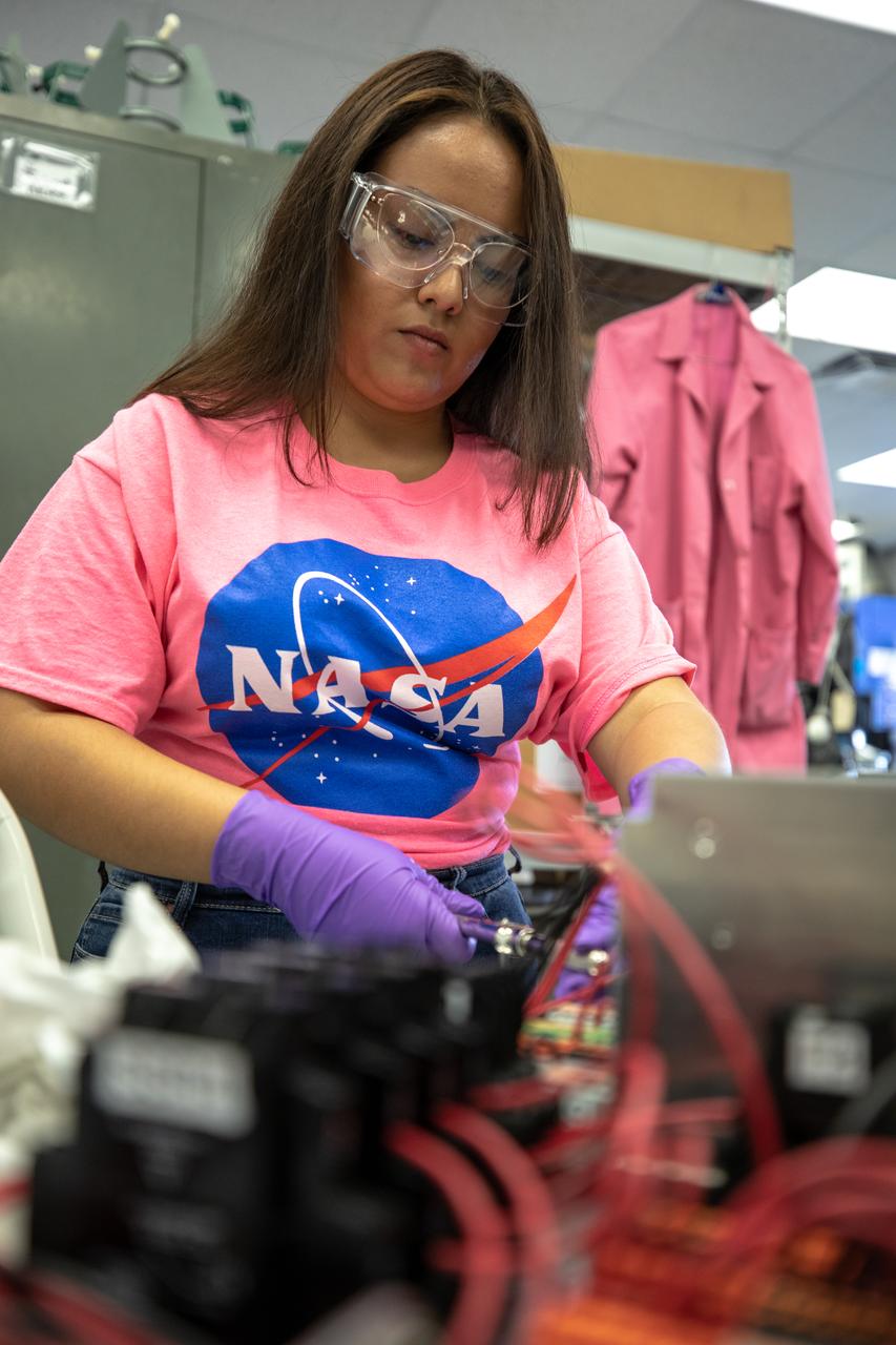 Brianna Sandoval, an intern at NASA’s Kennedy Space Center in Florida, assembles the flight hardware of the agency’s Orbital Syngas Commodity Augmentation Reactor, or OSCAR. OSCAR is an Early Career Initiative project at the spaceport that studies technology to convert trash and human waste into useful gasses such as methane, hydrogen and carbon dioxide. By processing small pieces of trash in a high-temperature reactor, OSCAR is advancing new and innovative technology for managing waste in space. OSCAR would reduce the amount of space needed for waste storage within a spacecraft, turn some waste into gasses that have energy storage and life support applications, and ensure waste is no longer biologically active. A prototype has been developed, and a team of Kennedy employees are in the process of constructing a new rig for suborbital flight testing. 