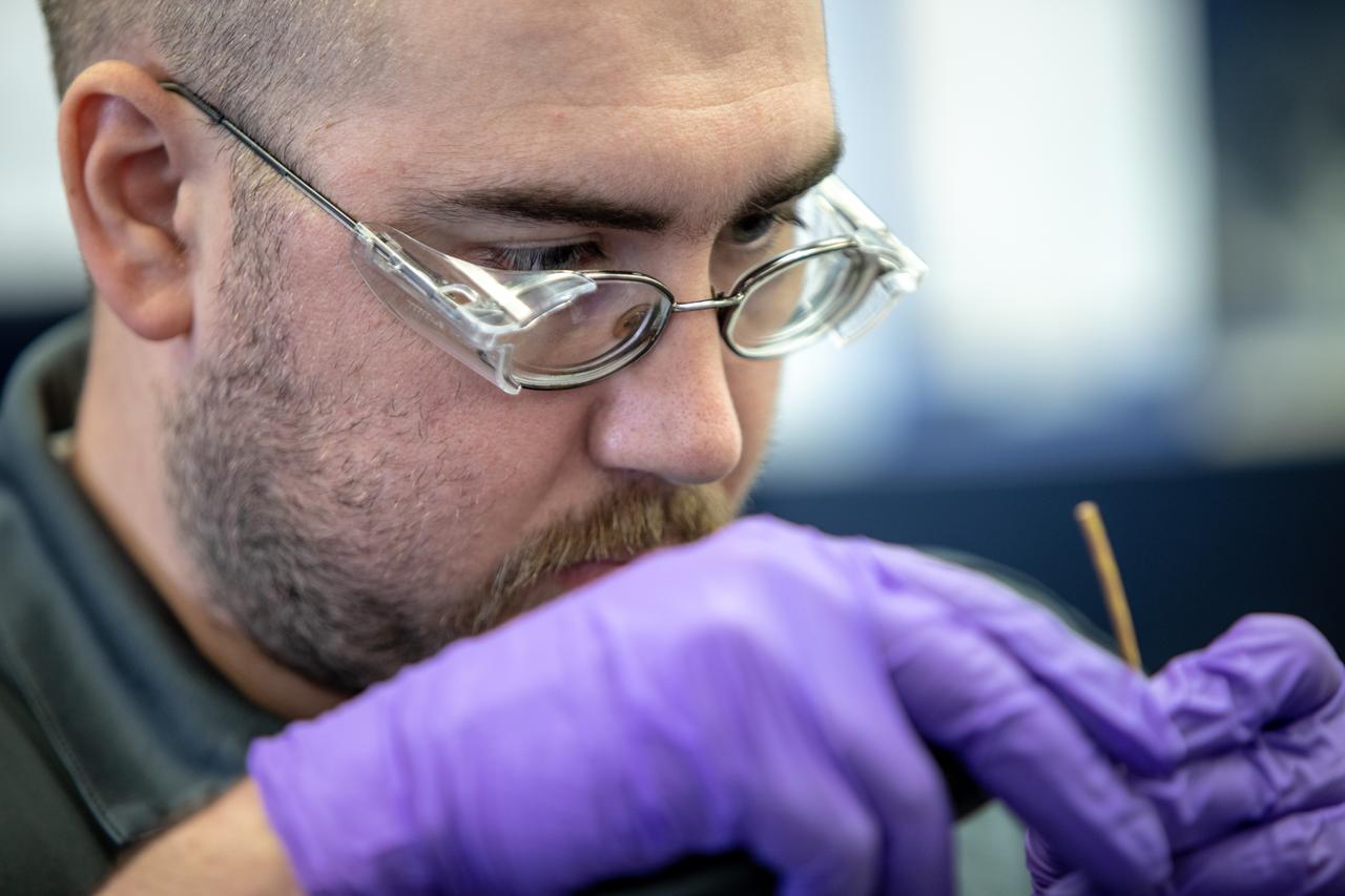 Thomas Cauvel, an intern assisting with software/electrical engineering on NASA’s Orbital Syngas Commodity Augmentation Reactor, or OSCAR, at Kennedy Space Center assembles the flight hardware. OSCAR is an Early Career Initiative project at the Florida spaceport that studies technology to convert trash and human waste into useful gasses such as methane, hydrogen and carbon dioxide. By processing small pieces of trash in a high-temperature reactor, OSCAR is advancing new and innovative technology for managing waste in space. OSCAR would reduce the amount of space needed for waste storage within a spacecraft, turn some waste into gasses that have energy storage and life support applications, and ensure waste is no longer biologically active. A prototype has been developed, and a team of Kennedy employees are in the process of constructing a new rig for suborbital flight testing. 