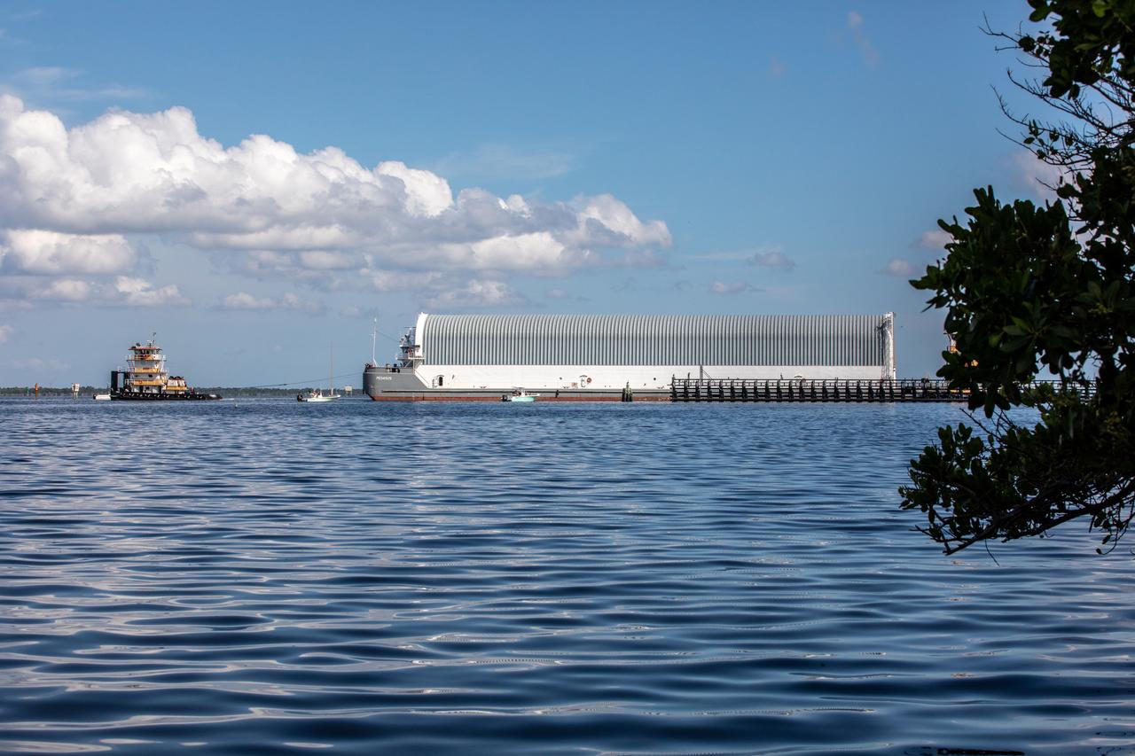 NASA's Pegasus Barge makes its way along the intercoastal waterway to its destination at the Kennedy Space Center Launch Complex 39 turn basin wharf, to make its first delivery to Kennedy in support of the agency's Artemis missions. The upgraded 310-foot-long barge arrived Sept. 27, 2019, ferrying the 212-foot-long Space Launch System rocket core stage pathfinder. The pathfinder is a full-scale mock-up of the rocket's core stage. The pathfinder will be used by the Exploration Ground Systems Program and their contractor, Jacobs, to practice offloading, moving and stacking maneuvers, using important ground support equipment to train employees and certify all the equipment works properly. The pathfinder will stay at Kennedy for approximately one month before trekking back to NASA's Michoud Assembly Facility in Louisiana.