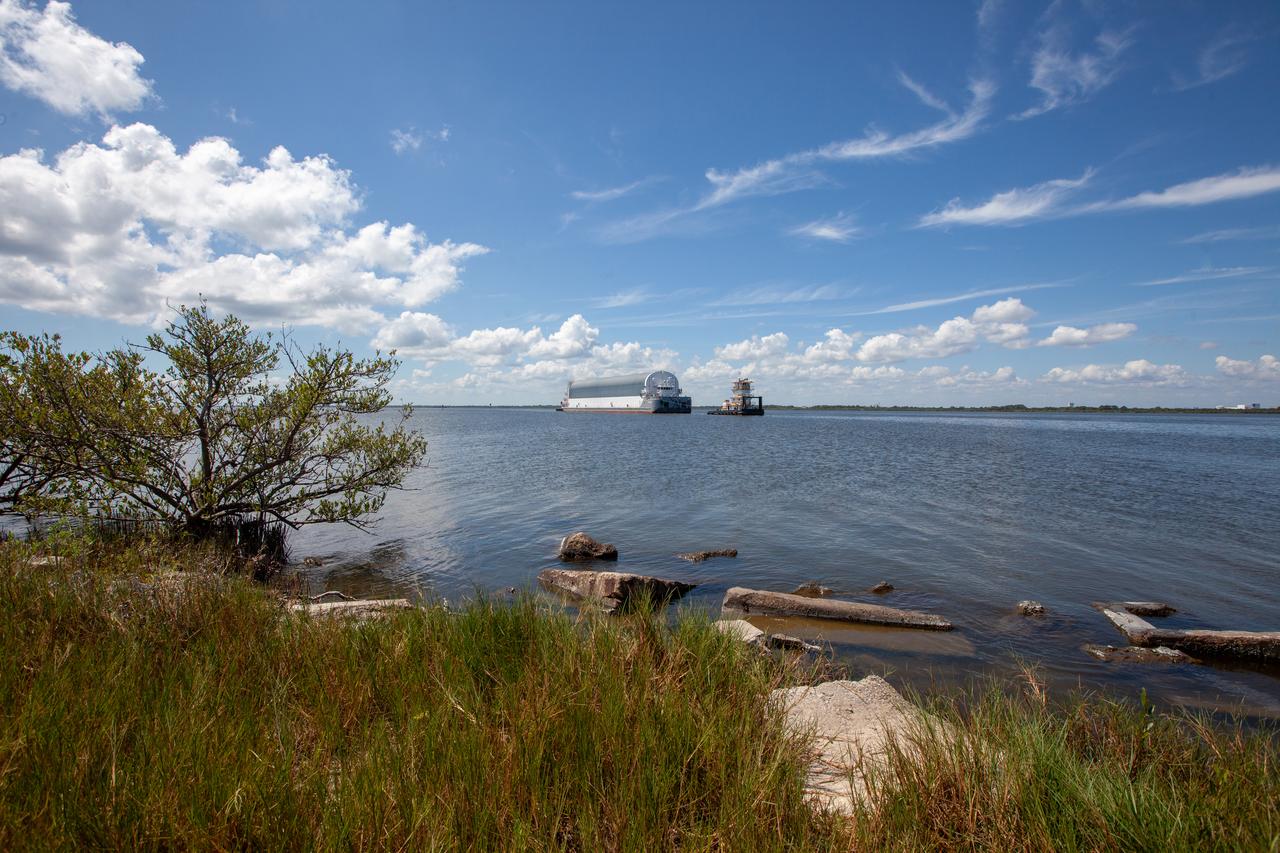 NASA's Pegasus Barge makes its way along the intercoastal waterway to its destination at the Kennedy Space Center Launch Complex 39 turn basin wharf, to make its first delivery to Kennedy in support of the agency's Artemis missions. The upgraded 310-foot-long barge arrived Sept. 27, 2019, ferrying the 212-foot-long Space Launch System rocket core stage pathfinder. The pathfinder is a full-scale mock-up of the rocket's core stage. The pathfinder will be used by the Exploration Ground Systems Program and their contractor, Jacobs, to practice offloading, moving and stacking maneuvers, using important ground support equipment to train employees and certify all the equipment works properly. The pathfinder will stay at Kennedy for approximately one month before trekking back to NASA's Michoud Assembly Facility in Louisiana.