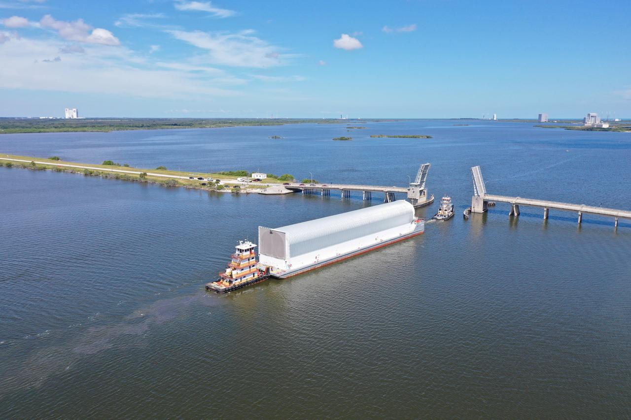 NASA's Pegasus Barge makes its way along the intercoastal waterway to its destination at the Kennedy Space Center Launch Complex 39 turn basin wharf, to make its first delivery to Kennedy in support of the agency's Artemis missions. The upgraded 310-foot-long barge arrived Sept. 27, 2019, ferrying the 212-foot-long Space Launch System rocket core stage pathfinder. The pathfinder is a full-scale mock-up of the rocket's core stage. The pathfinder will be used by the Exploration Ground Systems Program and their contractor, Jacobs, to practice offloading, moving and stacking maneuvers, using important ground support equipment to train employees and certify all the equipment works properly. The pathfinder will stay at Kennedy for approximately one month before trekking back to NASA's Michoud Assembly Facility in Louisiana.