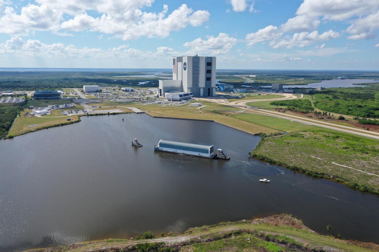 NASA's Pegasus Barge travels on the inland waterway to its destination at the Kennedy Space Center Launch Complex 39 turn basin wharf, to make its first delivery to Kennedy in support of the agency's Artemis missions. The upgraded 310-foot-long barge arrived Sept. 27, 2019, ferrying the 212-foot-long Space Launch System rocket core stage pathfinder. The pathfinder is a full-scale mock-up of the rocket's core stage. The pathfinder will be used by the Exploration Ground Systems Program and their contractor, Jacobs, to practice offloading, moving and stacking maneuvers, using important ground support equipment to train employees and certify all the equipment works properly. The pathfinder will stay at Kennedy for approximately one month before trekking back to NASA's Michoud Assembly Facility in Louisiana.
