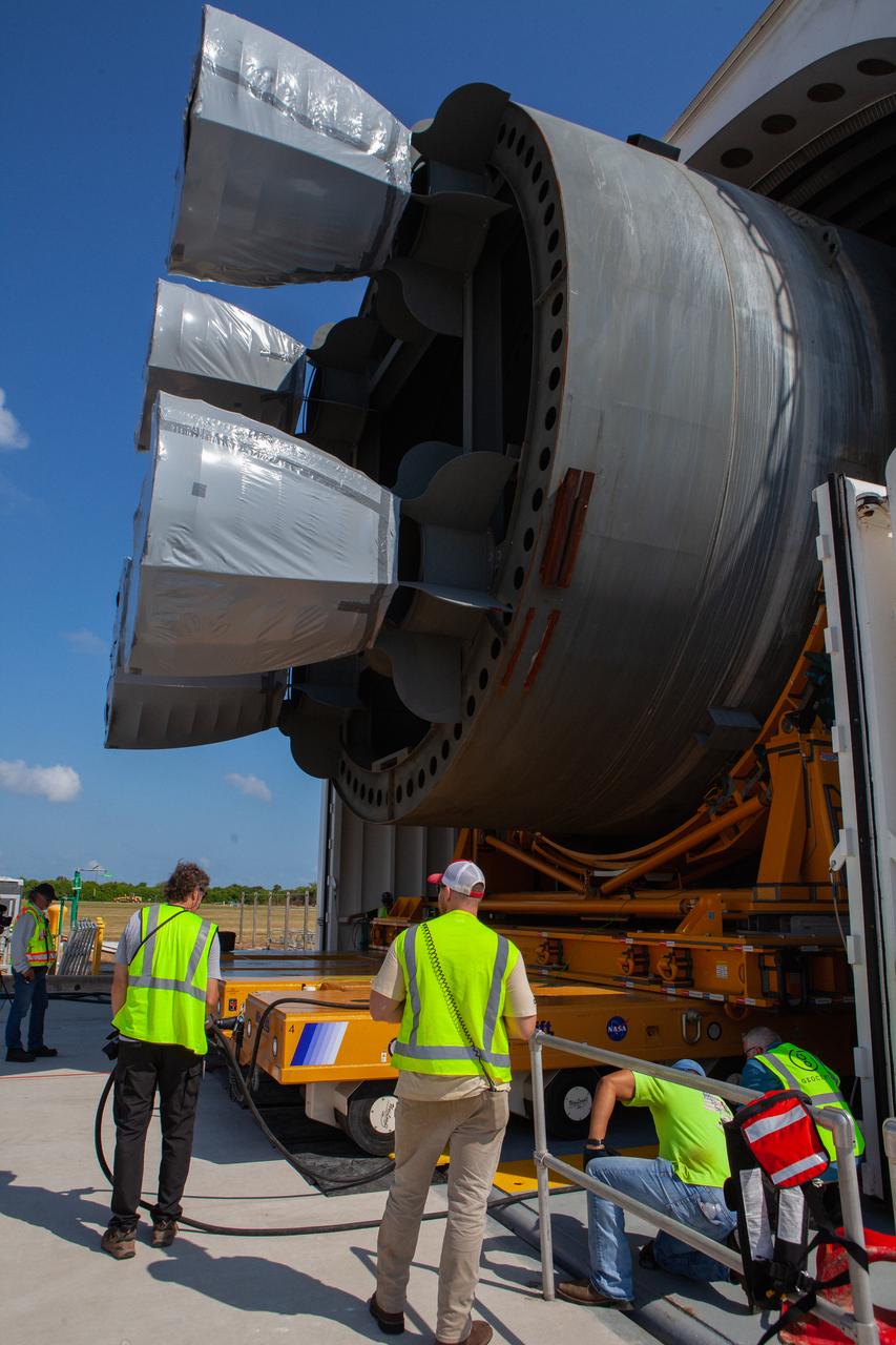 NASA and Jacobs technicians and engineers have begun offloading the 212-foot-long Space Launch System (SLS) rocket core stage pathfinder from NASA's Pegasus Barge at Kennedy Space Center’s Launch Complex 39 turn basin wharf on Sept. 30, 2019. The Pegasus Barge made its first delivery to Kennedy in support of the agency's Artemis missions. The upgraded 310-foot-long barge arrived Sept. 27, 2019, ferrying the SLS core stage pathfinder, a full-scale mock-up of the rocket's core stage. It will be used by the Exploration Ground Systems Program and their contractor, Jacobs, to practice offloading, moving and stacking maneuvers, using important ground support equipment to train employees and certify all the equipment works properly. The pathfinder will stay at Kennedy for approximately one month before trekking back to NASA's Michoud Assembly Facility in Louisiana.