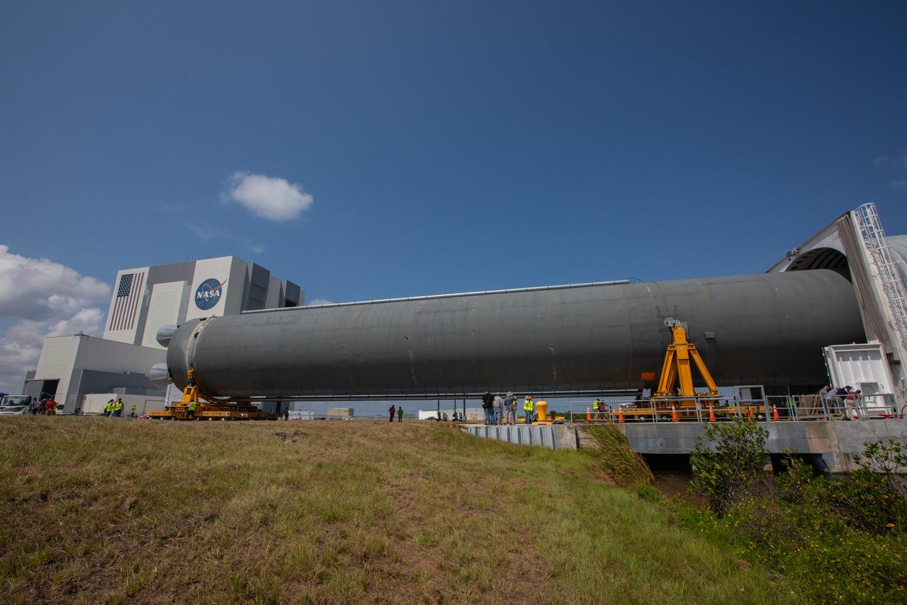 The 212-foot-long Space Launch System (SLS) rocket core stage pathfinder has been offloaded from NASA’s Pegasus Barge at Kennedy Space Center’s Launch Complex 39 turn basin wharf on Sept. 30, 2019. The Pegasus Barge made its first delivery to Kennedy in support of the agency's Artemis missions. The upgraded 310-foot-long barge arrived Sept. 27, 2019, ferrying the SLS core stage pathfinder, a full-scale mock-up of the rocket's core stage. It will be used by the Exploration Ground Systems Program and their contractor, Jacobs, to practice offloading, moving and stacking maneuvers, using important ground support equipment to train employees and certify all the equipment works properly. The pathfinder will stay at Kennedy for approximately one month before trekking back to NASA's Michoud Assembly Facility in Louisiana. 