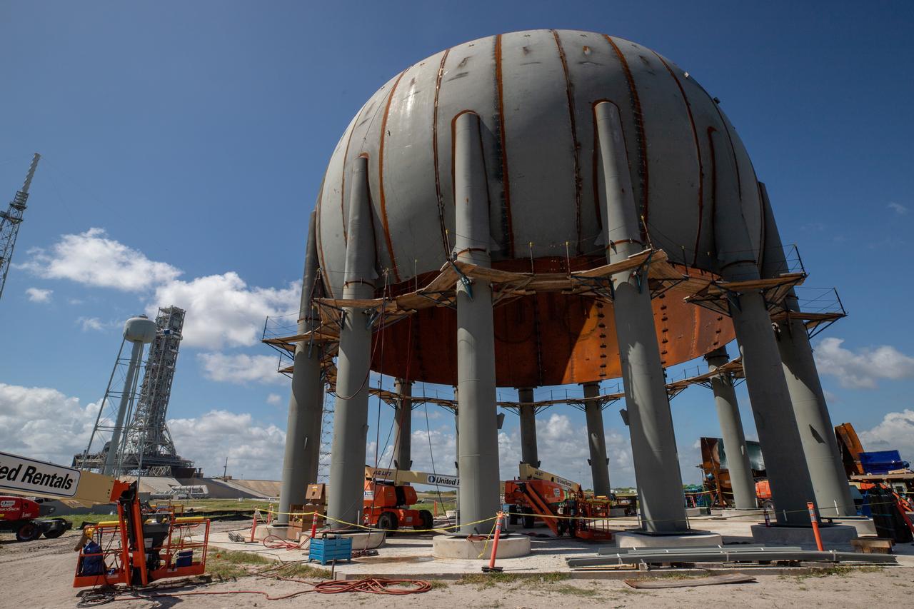 Build-up of a new liquid hydrogen (LH2) storage tank is in progress on Oct. 1, 2019, at Launch Complex 39B at NASA's Kennedy Space Center in Florida. The new tank will hold 1.25 million gallons of usable LH2 to support future launches from the pad, including Artemis missions to the Moon and on to Mars.