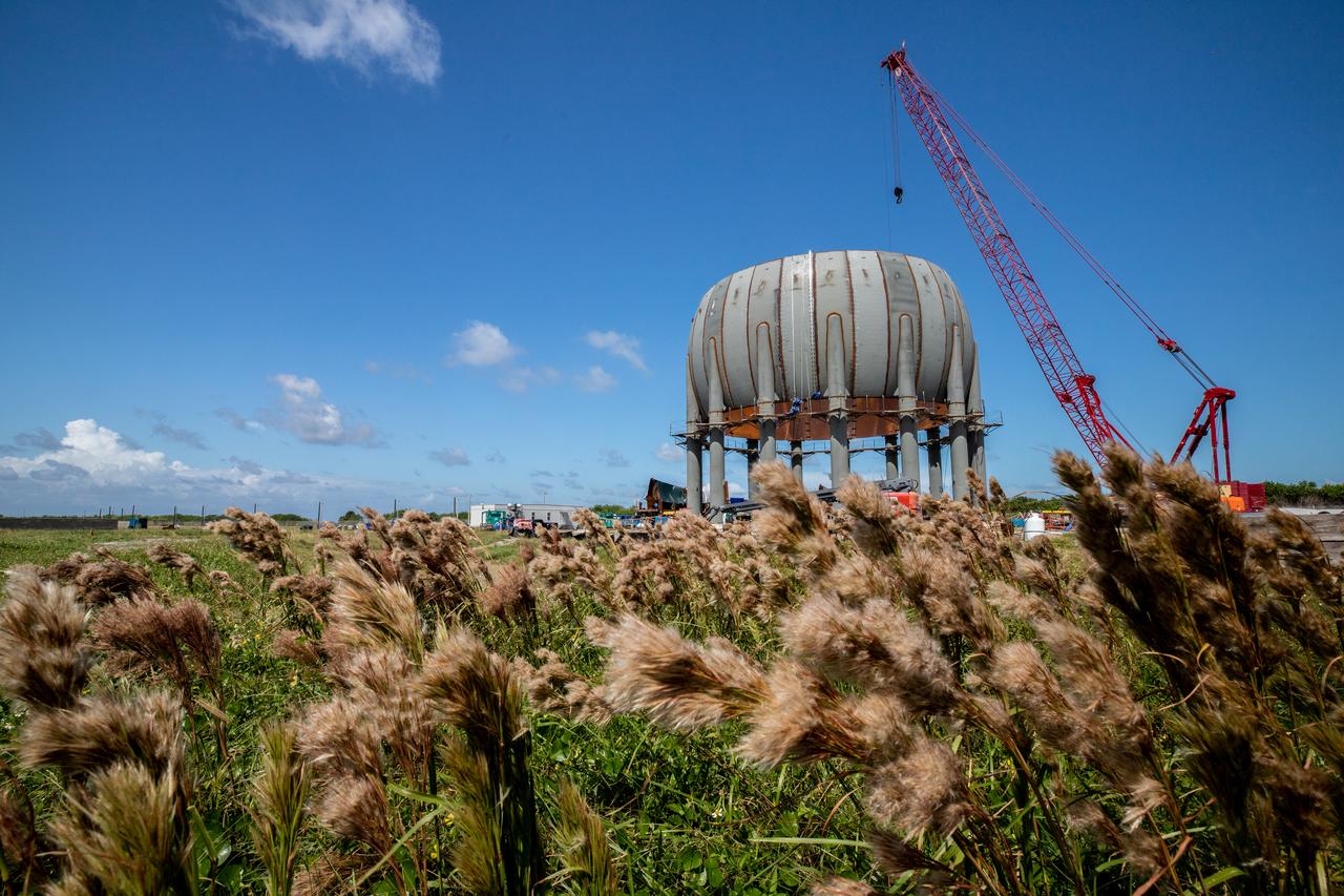 Build-up of a new liquid hydrogen (LH2) storage tank is in progress on Oct. 1, 2019, at Launch Complex 39B at NASA's Kennedy Space Center in Florida. The new tank will hold 1.25 million gallons of usable LH2 to support future launches from the pad, including Artemis missions to the Moon and on to Mars.