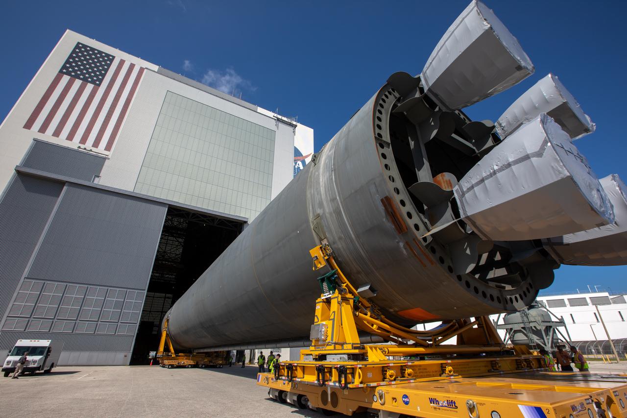 The 212-foot-long Space Launch System (SLS) rocket core stage pathfinder is moved into the low bay of the Vehicle Assembly Building at NASA’s Kennedy Space Center in Florida on Oct. 1, 2019. NASA's Pegasus Barge arrived at the Launch Complex 39 turn basin wharf on Sept. 30, 2019, making its first delivery to Kennedy in support of the agency's Artemis missions. The upgraded 310-foot-long barge arrived Sept. 27, 2019, ferrying the SLS core stage pathfinder, a full-scale mock-up of the rocket's core stage. The pathfinder will be used by the Exploration Ground Systems Program and their contractor, Jacobs, to practice offloading, moving and stacking maneuvers, using important ground support equipment to train employees and certify all the equipment works properly. The pathfinder will stay at Kennedy for approximately one month before trekking back to NASA's Michoud Assembly Facility in Louisiana.