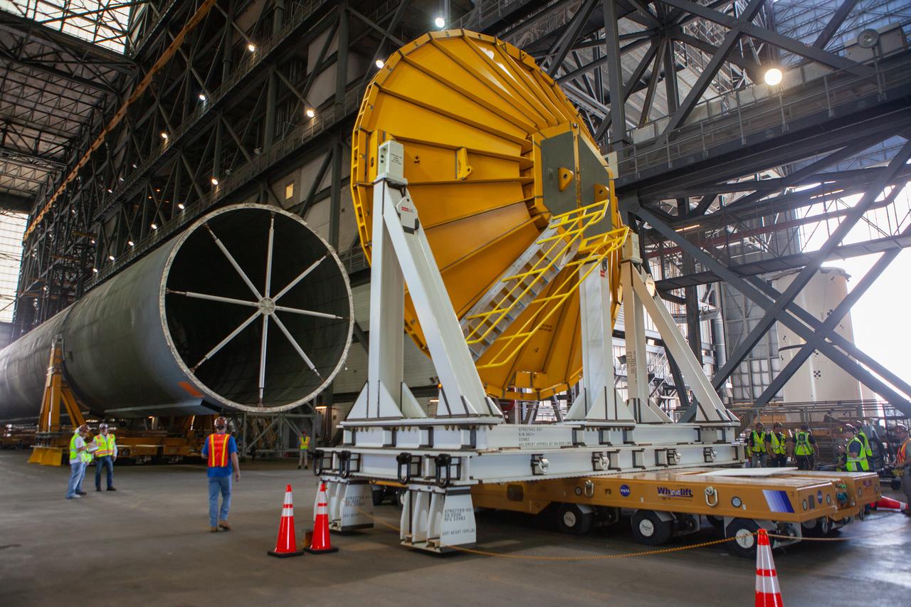Inside the Vehicle Assembly Building at NASA’s Kennedy Space Center in Florida, operations are underway to attach a cover, called a spider, to the top of the Space Launch System (SLS) Core Stage pathfinder on Oct. 3, 2019. With the spider secured in place, a crane will be attached to it to lift the pathfinder into the vertical position. The 212-foot-long core stage pathfinder arrived in NASA's Pegasus Barge at Kennedy’s Launch Complex 39 turn basin wharf on Sept. 27, 2019. The Pegasus Barge made its first delivery to Kennedy in support of the agency's Artemis missions. The upgraded 310-foot-long barge arrived, ferrying the SLS core stage pathfinder, a full-scale mock-up of the rocket's core stage. It will be used by Exploration Ground Systems and its contractor, Jacobs, to practice offloading, moving and stacking maneuvers, using important ground support equipment to train employees and certify all the equipment works properly. The pathfinder will stay at Kennedy for approximately one month before trekking back to NASA's Michoud Assembly Facility in Louisiana.