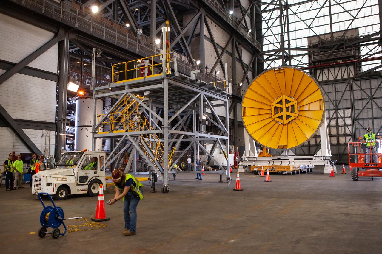 Preparations are underway to move the Space Launch System Core Stage pathfinder to the north end of the transfer aisle inside the Vehicle Assembly Building at NASA’s Kennedy Space Center in Florida on Oct. 3, 2019. A cover, called a spider, in view at the far end of the transfer aisle, will be attached to the top of the pathfinder. With the spider secured in place, a crane will be attached to it to lift the pathfinder into the vertical position. The 212-foot-long core stage pathfinder arrived in NASA's Pegasus Barge at Kennedy’s Launch Complex 39 turn basin wharf on Sept. 27, 2019. The Pegasus Barge made its first delivery to Kennedy in support of the agency's Artemis missions. The upgraded 310-foot-long barge arrived, ferrying the SLS core stage pathfinder, a full-scale mock-up of the rocket's core stage. It will be used by Exploration Ground Systems and its contractor, Jacobs, to practice offloading, moving and stacking maneuvers, using important ground support equipment to train employees and certify all the equipment works properly. The pathfinder will stay at Kennedy for approximately one month before trekking back to NASA's Michoud Assembly Facility in Louisiana.