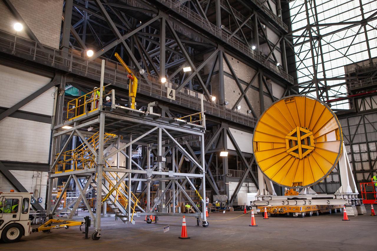 Preparations are underway to move the Space Launch System Core Stage pathfinder to the north end of the transfer aisle inside the Vehicle Assembly Building at NASA’s Kennedy Space Center in Florida on Oct. 3, 2019. A cover, called a spider, in view at the far end of the transfer aisle, will be attached to the top of the pathfinder. With the spider secured in place, a crane will be attached to it to lift the pathfinder into the vertical position. The 212-foot-long core stage pathfinder arrived in NASA's Pegasus Barge at Kennedy’s Launch Complex 39 turn basin wharf on Sept. 27, 2019. The Pegasus Barge made its first delivery to Kennedy in support of the agency's Artemis missions. The upgraded 310-foot-long barge arrived, ferrying the SLS core stage pathfinder, a full-scale mock-up of the rocket's core stage. It will be used by Exploration Ground Systems and its contractor, Jacobs, to practice offloading, moving and stacking maneuvers, using important ground support equipment to train employees and certify all the equipment works properly. The pathfinder will stay at Kennedy for approximately one month before trekking back to NASA's Michoud Assembly Facility in Louisiana.