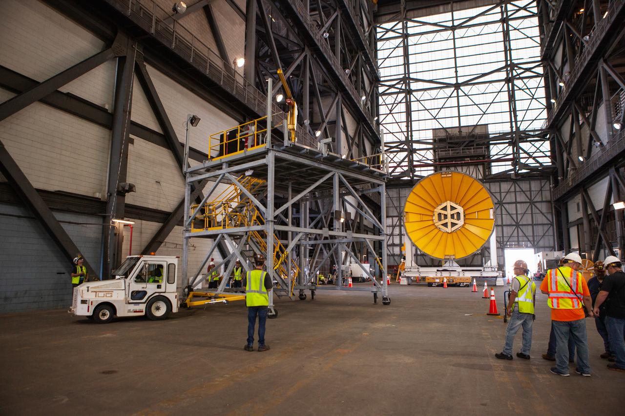Preparations are underway to move the Space Launch System Core Stage pathfinder to the north end of the transfer aisle inside the Vehicle Assembly Building at NASA’s Kennedy Space Center in Florida on Oct. 3, 2019. A cover, called a spider, in view at the far end of the transfer aisle, will be attached to the top of the pathfinder. With the spider secured in place, a crane will be attached to it to lift the pathfinder into the vertical position. The 212-foot-long core stage pathfinder arrived in NASA's Pegasus Barge at Kennedy’s Launch Complex 39 turn basin wharf on Sept. 27, 2019. The Pegasus Barge made its first delivery to Kennedy in support of the agency's Artemis missions. The upgraded 310-foot-long barge arrived, ferrying the SLS core stage pathfinder, a full-scale mock-up of the rocket's core stage. It will be used by Exploration Ground Systems and its contractor, Jacobs, to practice offloading, moving and stacking maneuvers, using important ground support equipment to train employees and certify all the equipment works properly. The pathfinder will stay at Kennedy for approximately one month before trekking back to NASA's Michoud Assembly Facility in Louisiana.