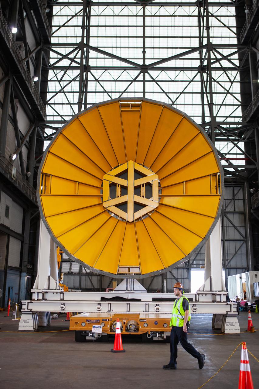 Preparations are underway to move the Space Launch System Core Stage pathfinder to the north end of the transfer aisle inside the Vehicle Assembly Building at NASA’s Kennedy Space Center in Florida on Oct. 3, 2019. A cover, called a spider, in view at the far end of the transfer aisle, will be attached to the top of the pathfinder. With the spider secured in place, a crane will be attached to it to lift the pathfinder into the vertical position. The 212-foot-long core stage pathfinder arrived in NASA's Pegasus Barge at Kennedy’s Launch Complex 39 turn basin wharf on Sept. 27, 2019. The Pegasus Barge made its first delivery to Kennedy in support of the agency's Artemis missions. The upgraded 310-foot-long barge arrived, ferrying the SLS core stage pathfinder, a full-scale mock-up of the rocket's core stage. It will be used by Exploration Ground Systems and its contractor, Jacobs, to practice offloading, moving and stacking maneuvers, using important ground support equipment to train employees and certify all the equipment works properly. The pathfinder will stay at Kennedy for approximately one month before trekking back to NASA's Michoud Assembly Facility in Louisiana.