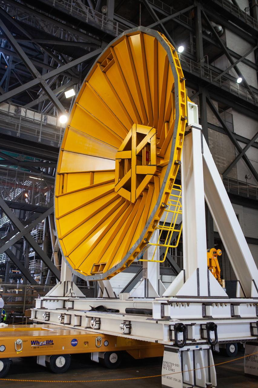 Preparations are underway to move the Space Launch System Core Stage pathfinder to the north end of the transfer aisle inside the Vehicle Assembly Building at NASA’s Kennedy Space Center in Florida on Oct. 3, 2019. A cover, called a spider, in view at the far end of the transfer aisle, will be attached to the top of the pathfinder. With the spider secured in place, a crane will be attached to it to lift the pathfinder into the vertical position. The 212-foot-long core stage pathfinder arrived in NASA's Pegasus Barge at Kennedy’s Launch Complex 39 turn basin wharf on Sept. 27, 2019. The Pegasus Barge made its first delivery to Kennedy in support of the agency's Artemis missions. The upgraded 310-foot-long barge arrived, ferrying the SLS core stage pathfinder, a full-scale mock-up of the rocket's core stage. It will be used by Exploration Ground Systems and its contractor, Jacobs, to practice offloading, moving and stacking maneuvers, using important ground support equipment to train employees and certify all the equipment works properly. The pathfinder will stay at Kennedy for approximately one month before trekking back to NASA's Michoud Assembly Facility in Louisiana.