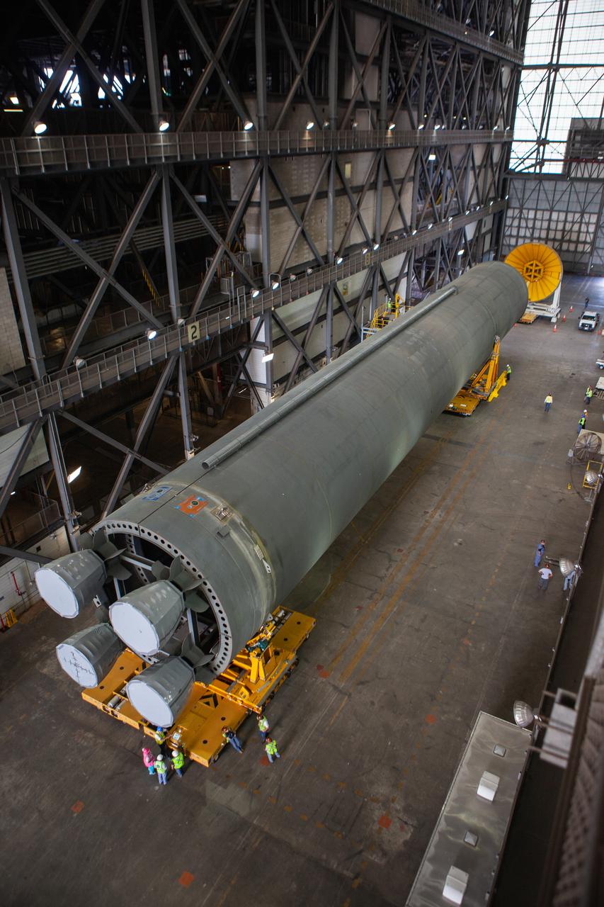 The Space Launch System Core Stage pathfinder has arrived at the north end of the transfer aisle inside the Vehicle Assembly Building at NASA’s Kennedy Space Center in Florida on Oct. 3, 2019. A cover, called a spider, will be attached to the top of the pathfinder. With the spider secured in place, a crane will be attached to it to lift the pathfinder into the vertical position. The 212-foot-long core stage pathfinder arrived in NASA's Pegasus Barge at Kennedy’s Launch Complex 39 turn basin wharf on Sept. 27, 2019. The Pegasus Barge made its first delivery to Kennedy in support of the agency's Artemis missions. The upgraded 310-foot-long barge arrived, ferrying the SLS core stage pathfinder, a full-scale mock-up of the rocket's core stage. It will be used by Exploration Ground Systems and its contractor, Jacobs, to practice offloading, moving and stacking maneuvers, using important ground support equipment to train employees and certify all the equipment works properly. The pathfinder will stay at Kennedy for approximately one month before trekking back to NASA's Michoud Assembly Facility in Louisiana.