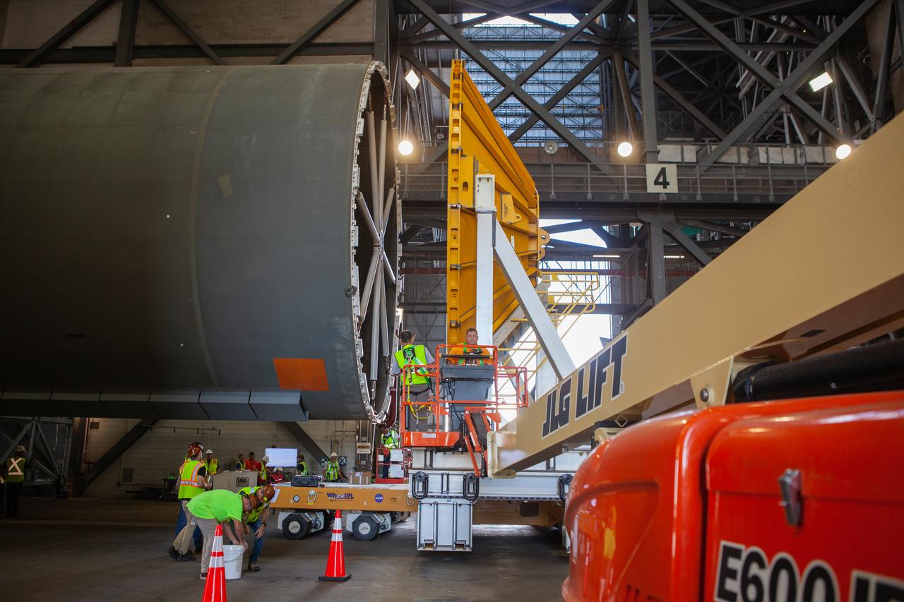 Inside the Vehicle Assembly Building at NASA’s Kennedy Space Center in Florida, operations are underway to attach a cover, called a spider, to the top of the Space Launch System (SLS) Core Stage pathfinder on Oct. 4, 2019. With the spider secured in place, a crane will be attached to it to lift the pathfinder into the vertical position. The 212-foot-long core stage pathfinder arrived on NASA's Pegasus Barge at Kennedy’s Launch Complex 39 turn basin wharf on Sept. 27, 2019. The Pegasus Barge made its first delivery to Kennedy in support of the agency's Artemis missions. The upgraded 310-foot-long barge arrived, ferrying the SLS core stage pathfinder, a full-scale mock-up of the rocket's core stage. It will be used by Exploration Ground Systems and its contractor, Jacobs, to practice offloading, moving and stacking maneuvers, using important ground support equipment to train employees and certify all the equipment works properly. The pathfinder will stay at Kennedy for approximately one month before trekking back to NASA's Michoud Assembly Facility in Louisiana.