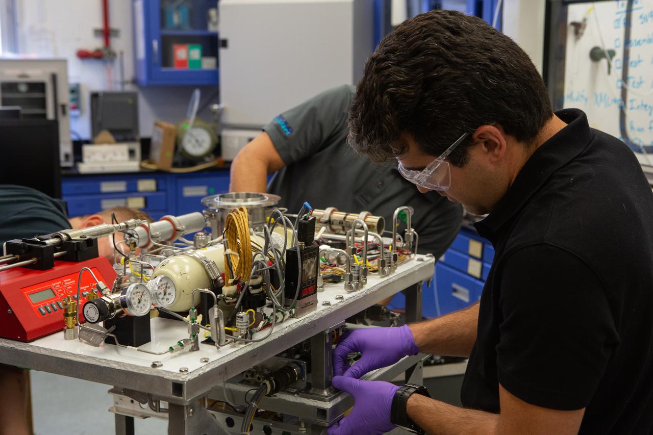 Jaime Toro assembles the flight hardware for NASA’s Orbital Syngas Commodity Augmentation Reactor, or OSCAR, on Oct. 10, 2019, in the Space Station Processing Facility at the agency’s Kennedy Space Center in Florida. OSCAR is an Early Career Initiative project at the spaceport that studies technology to convert trash and human waste into useful gasses such as methane, hydrogen and carbon dioxide. By processing small pieces of trash in a high-temperature reactor, OSCAR is advancing new and innovative technology for managing waste in space. A prototype has been developed, and the team is in the process of constructing a new rig for a suborbital flight test.
