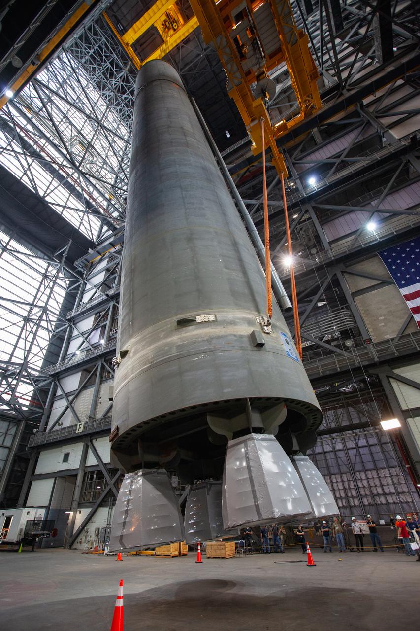 Inside the Vehicle Assembly Building at NASA’s Kennedy Space Center in Florida, two cranes are used to lift the Space Launch System (SLS) Core Stage pathfinder into the vertical position in the transfer aisle on Oct. 15, 2019. The 212-foot-long core stage pathfinder arrived on NASA's Pegasus Barge at Kennedy’s Launch Complex 39 turn basin wharf on Sept. 27, 2019. The Pegasus Barge made its first delivery to Kennedy in support of the agency's Artemis missions. The pathfinder is being used by Exploration Ground Systems and its contractor, Jacobs, to practice offloading, moving and stacking maneuvers, using important ground support equipment to train employees and certify all the equipment works properly. The pathfinder will stay at Kennedy through at least the month of October before trekking back to NASA's Michoud Assembly Facility in Louisiana.