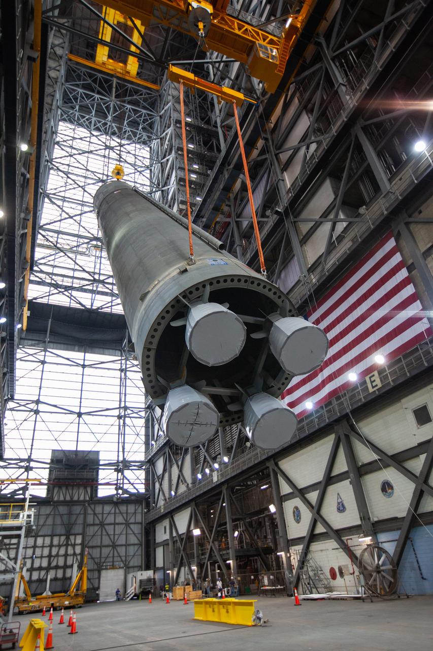 Inside the Vehicle Assembly Building at NASA’s Kennedy Space Center in Florida, the Space Launch System (SLS) Core Stage pathfinder is lifted into the vertical position in the transfer aisle on Oct. 15, 2019. The 212-foot-long core stage pathfinder arrived on NASA's Pegasus Barge at Kennedy’s Launch Complex 39 turn basin wharf on Sept. 27, 2019. The Pegasus Barge made its first delivery to Kennedy in support of the agency's Artemis missions. The pathfinder is being used by Exploration Ground Systems and its contractor, Jacobs, to practice offloading, moving and stacking maneuvers, using important ground support equipment to train employees and certify all the equipment works properly. The pathfinder will stay at Kennedy through at least the month of October before trekking back to NASA's Michoud Assembly Facility in Louisiana.