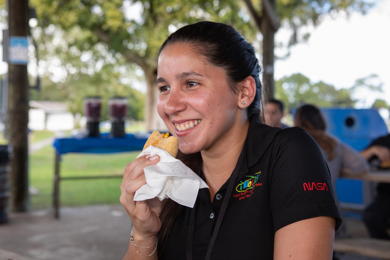 A NASA Kennedy Space Center workers enjoys a treat during a gathering at KARS Park II to celebrate Hispanic Heritage Month on Oct. 17, 2019. The event was hosted by the center’s Hispanic Outreach and Leadership Alliance (HOLA) employee resource group for Hispanic Heritage Month. This year’s theme is “Hispanic Americans: A History of Serving our Nation.” HOLA’s initiatives include education and recruitment, professional networking and development, and community outreach and media support.