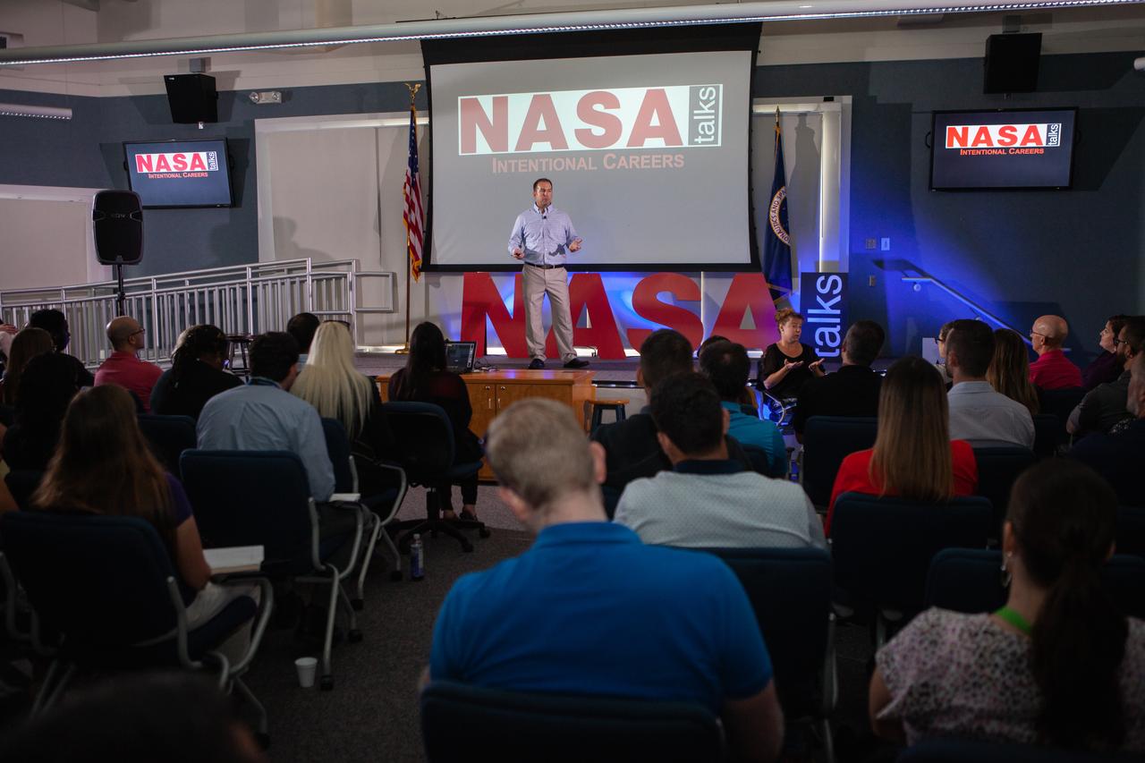Kennedy Space Center’s Dave Grau addresses co-workers inside the Florida spaceport’s Kennedy Learning Institute on Oct. 17, 2019, during the third in a series of five TED Talk-style informational sessions. Sponsored by Kennedy’s Launching Leaders and Leadership for the Future, NASAtalks focuses on the topic of intentional careers and aims to provide employees with tools and knowledge that can be utilized for career growth. The theme of this third session was customers, and additional speakers included Kennedy employees Ryan Richards and Mike Williams, with a skill-building section on active listening and negotiating by Tim Bass. 