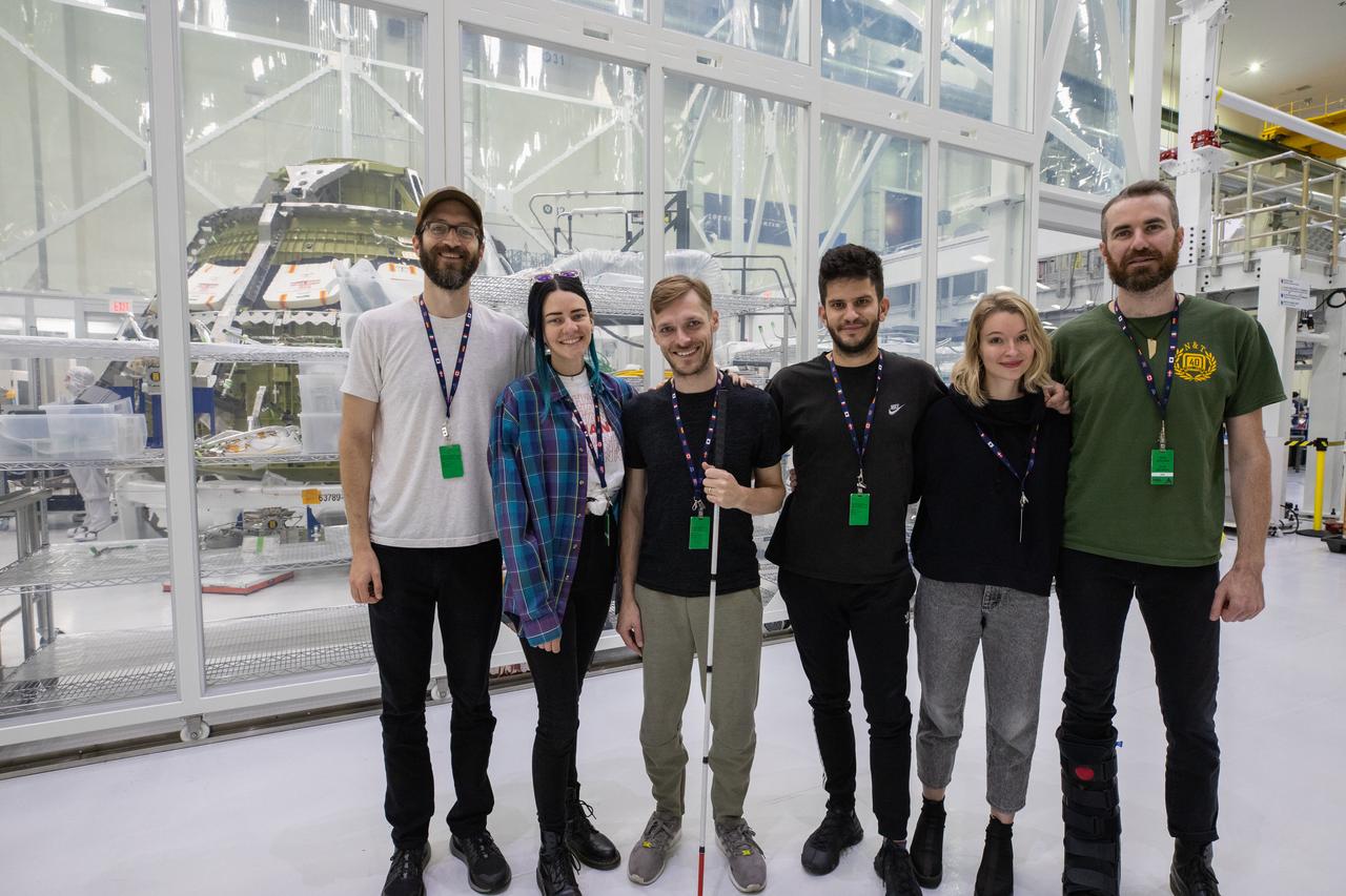 The rock band X Ambassadors is photographed in front of NASA’s Artemis II Orion crew module inside the Neil Armstrong Operations and Checkout (O&C) Building high bay at the agency’s Kennedy Space Center in Florida. X Ambassadors visited Kennedy on Oct. 21, 2019, and had the opportunity to tour areas around the multi-user spaceport such as the O&C, Launch Complex 39B and Swamp Works. The title of the band’s latest album, Orion, led them to an up-close look at the spacecraft that will take humans farther than they’ve ever gone before. 