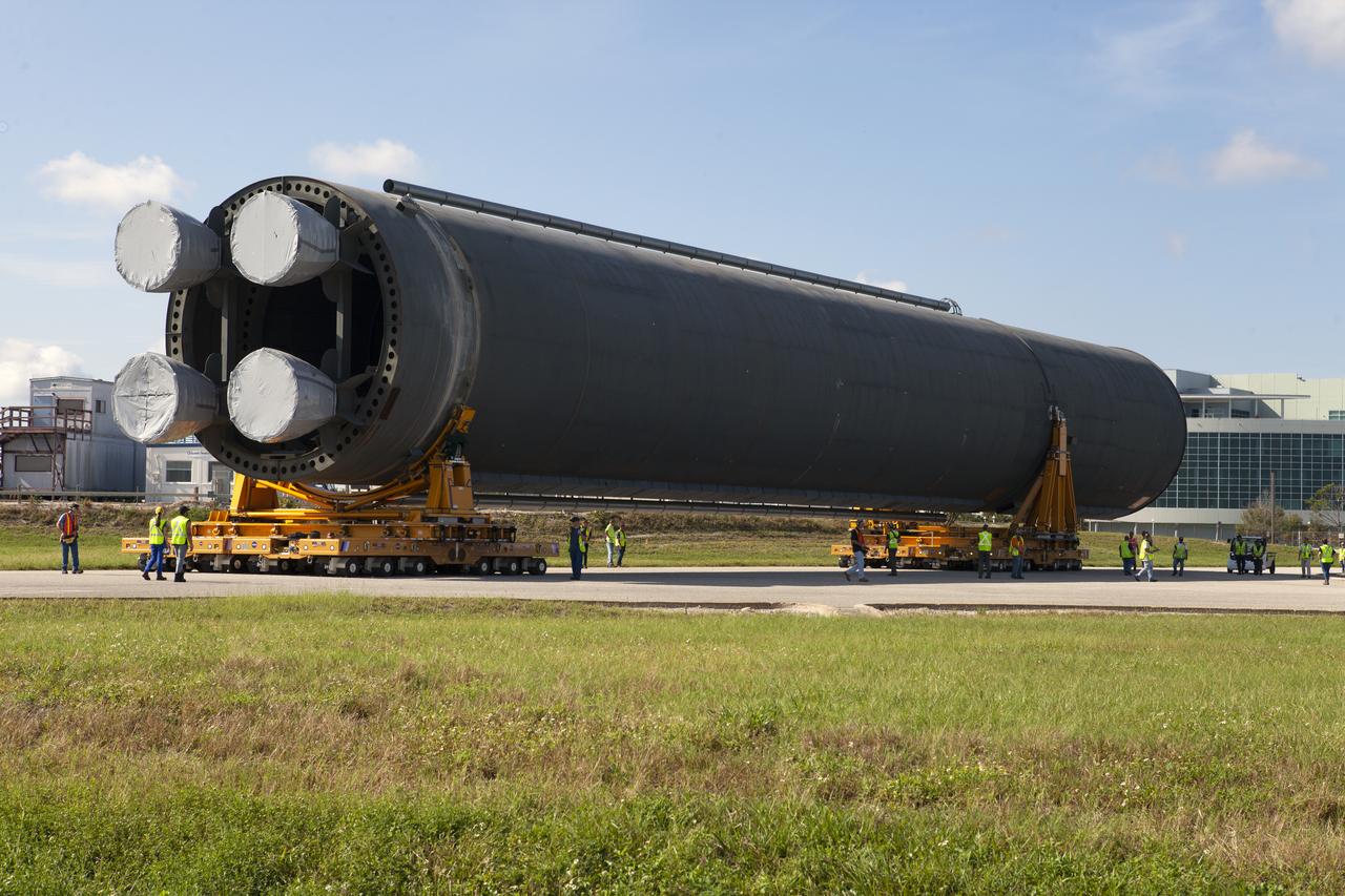 The 212-foot-long Space Launch System (SLS) rocket core stage pathfinder is being transported back to the Pegasus barge at the Launch Complex 39 turn basin wharf at NASA’s Kennedy Space Center in Florida on Oct. 28, 2019. The core stage pathfinder is a full-scale mock-up of the rocket's core stage. It was used by the Exploration Ground Systems Program and their contractor, Jacobs, to practice offloading, moving and stacking maneuvers inside the Vehicle Assembly Building, using important ground support equipment to train employees and certify all the equipment works properly. The pathfinder was at Kennedy for about a month. It will make the trek back to NASA's Michoud Assembly Facility in Louisiana.