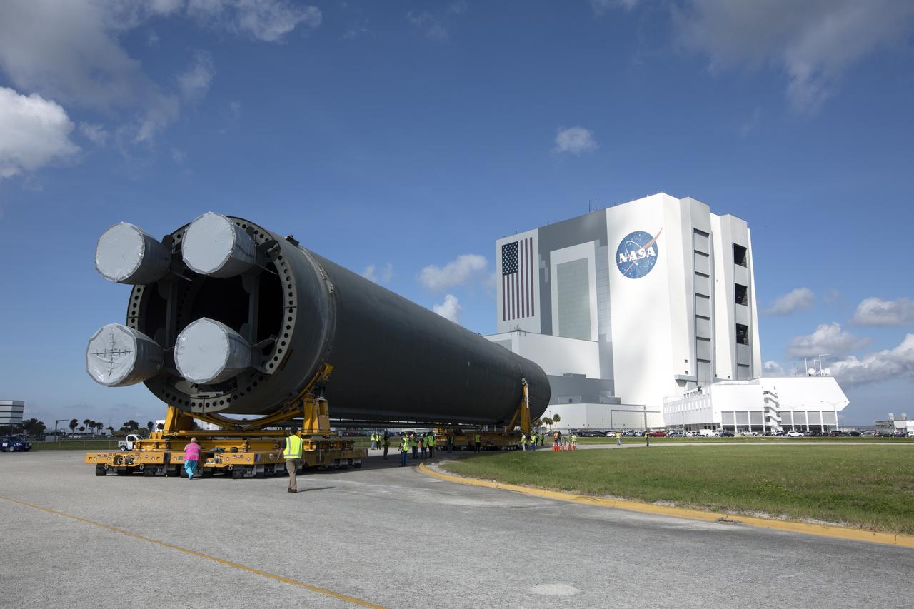 The 212-foot-long Space Launch System (SLS) rocket core stage pathfinder is being transported back to the Pegasus barge at the Launch Complex 39 turn basin wharf at NASA’s Kennedy Space Center in Florida on Oct. 28, 2019. The core stage pathfinder is a full-scale mock-up of the rocket's core stage. It was used by the Exploration Ground Systems Program and their contractor, Jacobs, to practice offloading, moving and stacking maneuvers inside the Vehicle Assembly Building, using important ground support equipment to train employees and certify all the equipment works properly. The pathfinder was at Kennedy for about a month. It will make the trek back to NASA's Michoud Assembly Facility in Louisiana.