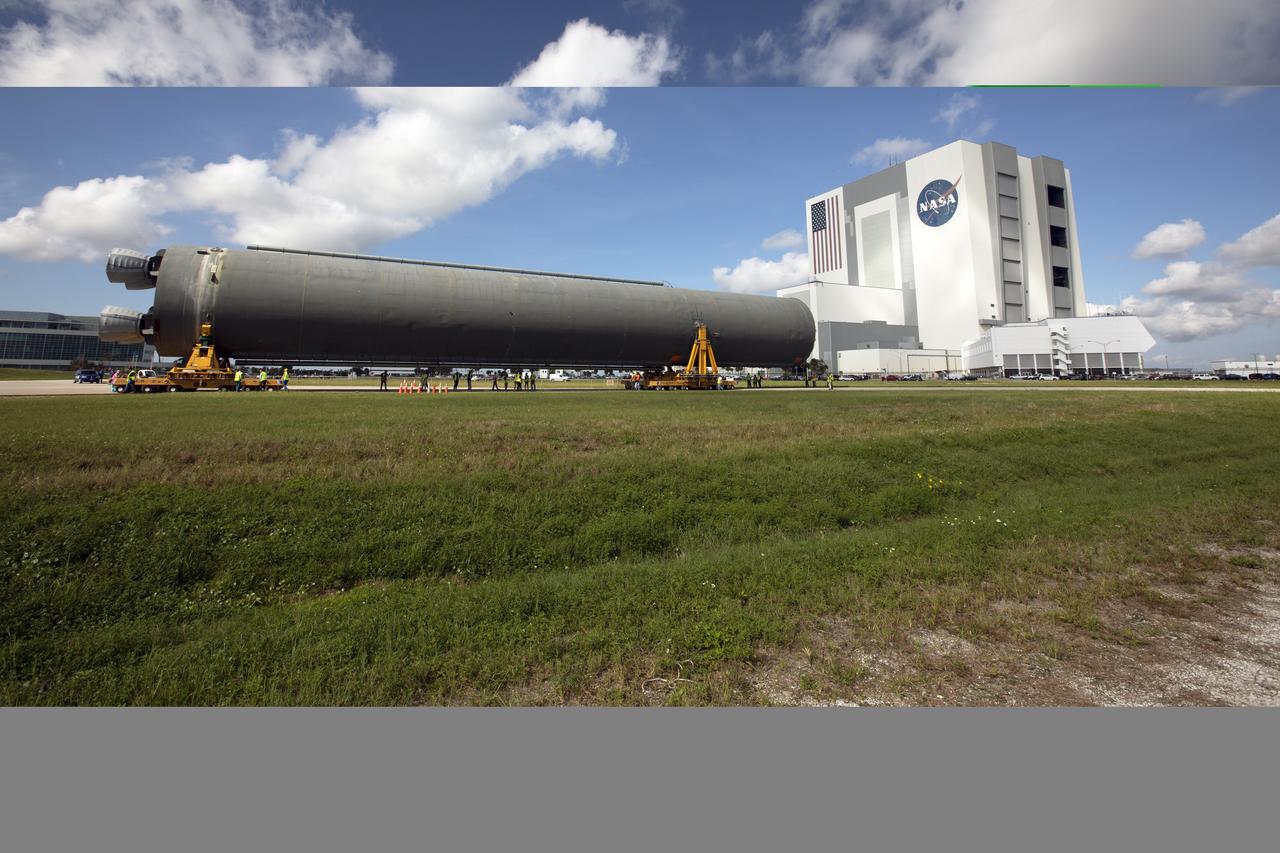 The 212-foot-long Space Launch System (SLS) rocket core stage pathfinder is being transported back to the Pegasus barge at the Launch Complex 39 turn basin wharf at NASA’s Kennedy Space Center in Florida on Oct. 28, 2019. The core stage pathfinder is a full-scale mock-up of the rocket's core stage. It was used by the Exploration Ground Systems Program and their contractor, Jacobs, to practice offloading, moving and stacking maneuvers inside the Vehicle Assembly Building, using important ground support equipment to train employees and certify all the equipment works properly. The pathfinder was at Kennedy for about a month. It will make the trek back to NASA's Michoud Assembly Facility in Louisiana.