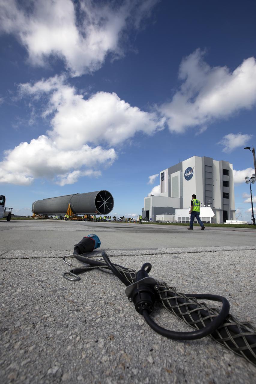 The 212-foot-long Space Launch System (SLS) rocket core stage pathfinder nears the entrance ramp to the Pegasus barge at the Launch Complex 39 turn basin wharf at NASA’s Kennedy Space Center in Florida on Oct. 28, 2019. The core stage pathfinder is a full-scale mock-up of the rocket's core stage. It was used by the Exploration Ground Systems Program and their contractor, Jacobs, to practice offloading, moving and stacking maneuvers inside the Vehicle Assembly Building, using important ground support equipment to train employees and certify all the equipment works properly. The pathfinder was at Kennedy for about a month. It will make the trek back to NASA's Michoud Assembly Facility in Louisiana.