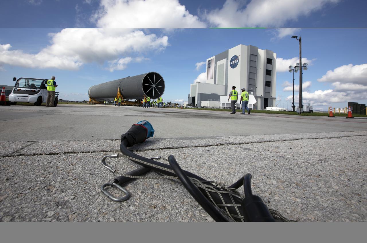 The 212-foot-long Space Launch System (SLS) rocket core stage pathfinder nears the entrance ramp to the Pegasus barge at the Launch Complex 39 turn basin wharf at NASA’s Kennedy Space Center in Florida on Oct. 28, 2019. The core stage pathfinder is a full-scale mock-up of the rocket's core stage. It was used by the Exploration Ground Systems Program and their contractor, Jacobs, to practice offloading, moving and stacking maneuvers inside the Vehicle Assembly Building, using important ground support equipment to train employees and certify all the equipment works properly. The pathfinder was at Kennedy for about a month. It will make the trek back to NASA's Michoud Assembly Facility in Louisiana.