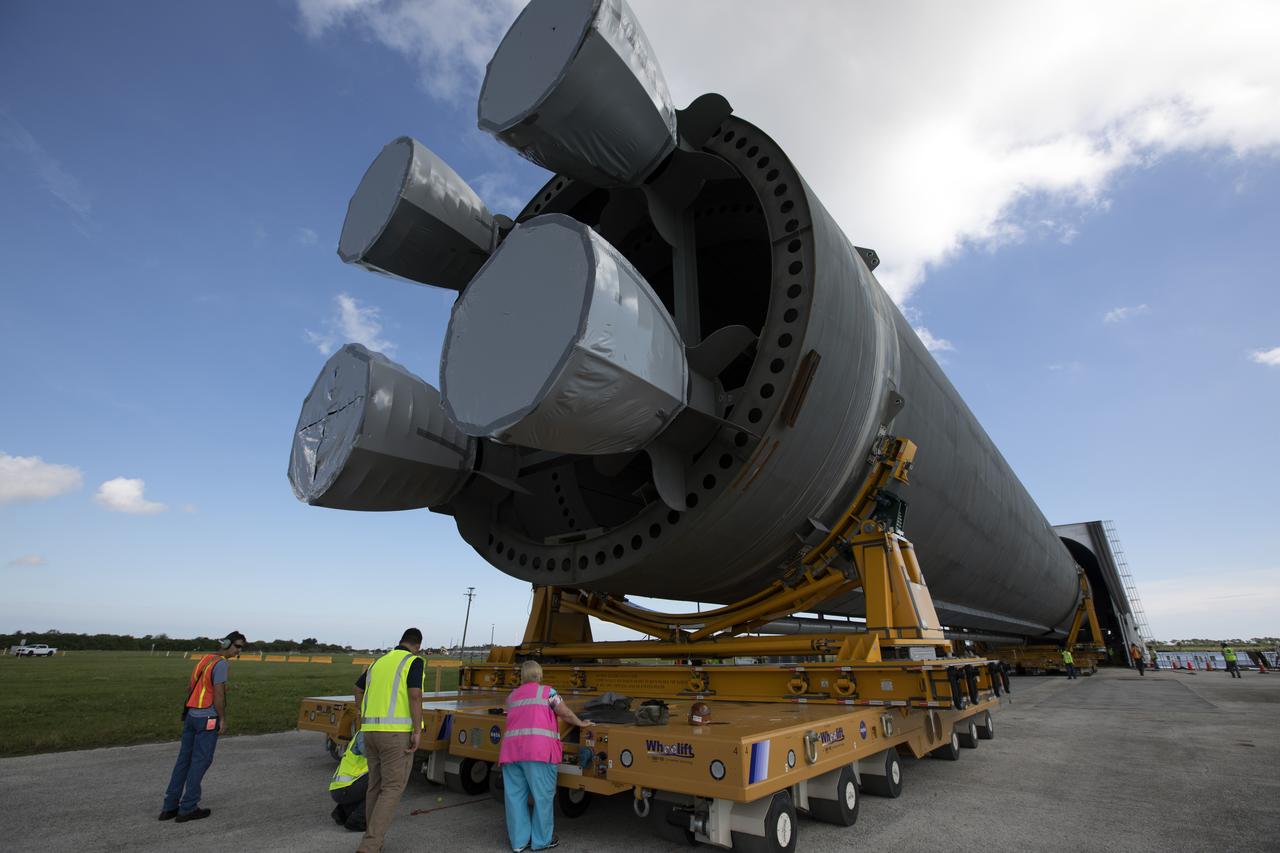 The 212-foot-long Space Launch System (SLS) rocket core stage pathfinder nears the entrance ramp to the Pegasus barge at the Launch Complex 39 turn basin wharf at NASA’s Kennedy Space Center in Florida on Oct. 28, 2019. The core stage pathfinder is a full-scale mock-up of the rocket's core stage. It was used by the Exploration Ground Systems Program and their contractor, Jacobs, to practice offloading, moving and stacking maneuvers inside the Vehicle Assembly Building, using important ground support equipment to train employees and certify all the equipment works properly. The pathfinder was at Kennedy for about a month. It will make the trek back to NASA's Michoud Assembly Facility in Louisiana.