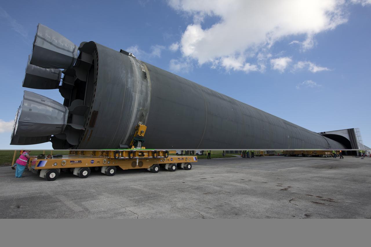 The 212-foot-long Space Launch System (SLS) rocket core stage pathfinder is moved inside the Pegasus barge at the Launch Complex 39 turn basin wharf at NASA’s Kennedy Space Center in Florida on Oct. 28, 2019. The core stage pathfinder is a full-scale mock-up of the rocket's core stage. It was used by the Exploration Ground Systems Program and their contractor, Jacobs, to practice offloading, moving and stacking maneuvers inside the Vehicle Assembly Building, using important ground support equipment to train employees and certify all the equipment works properly. The pathfinder was at Kennedy for about a month. It will make the trek back to NASA's Michoud Assembly Facility in Louisiana.