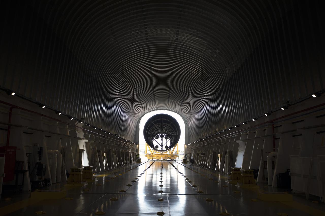 A view of the inside of the Pegasus barge at the Launch Complex 39 turn basin at NASA’s Kennedy Space Center in Florida, as the 212-foot-long Space Launch System (SLS) rocket core stage pathfinder is moved inside the barge on Oct. 28, 2019. The core stage pathfinder is a full-scale mock-up of the rocket's core stage. It was used by the Exploration Ground Systems Program and their contractor, Jacobs, to practice offloading, moving and stacking maneuvers inside the Vehicle Assembly Building, using important ground support equipment to train employees and certify all the equipment works properly. The pathfinder was at Kennedy for about a month. It will make the trek back to NASA's Michoud Assembly Facility in Louisiana.
