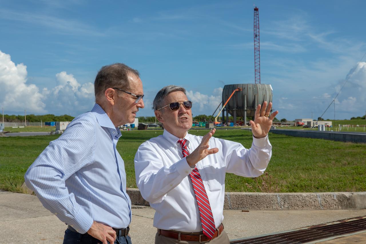 Kennedy Space Center Director Bob Cabana, at right, speaks to a member of the NASA Advisory Council at Launch Complex 39B during a tour of the multi-user spaceport on Oct. 30, 2019. In view behind them is the build-up of a new liquid hydrogen storage tank that will support Artemis launches to the Moon and on to Mars. The NASA Advisory Council provides the NASA administrator with counsel and advice on programs and issues of importance to the agency. Committee members conduct fact-finding sessions throughout the year in an effort to gain a broad understanding of current NASA issues and future mission implementation plans.