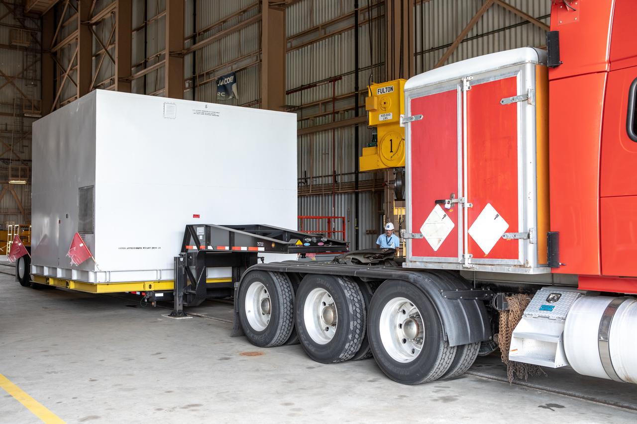The first of two Northrop Grumman aft exit cones for the Space Launch System’s solid rocket boosters arrives by truck in its shipping container at the Rotation, Processing and Surge Facility at NASA's Kennedy Space Center in Florida on Nov. 4, 2019. The aft exit cone was shipped from Promontory, Utah. It will be checked out and prepared for the Artemis I uncrewed test flight. The aft exit cones sit at the bottommost part of the twin boosters. They are attached to the aft skirts, which contain the booster separation motors. The exit cones help to protect the aft skirts during launch.