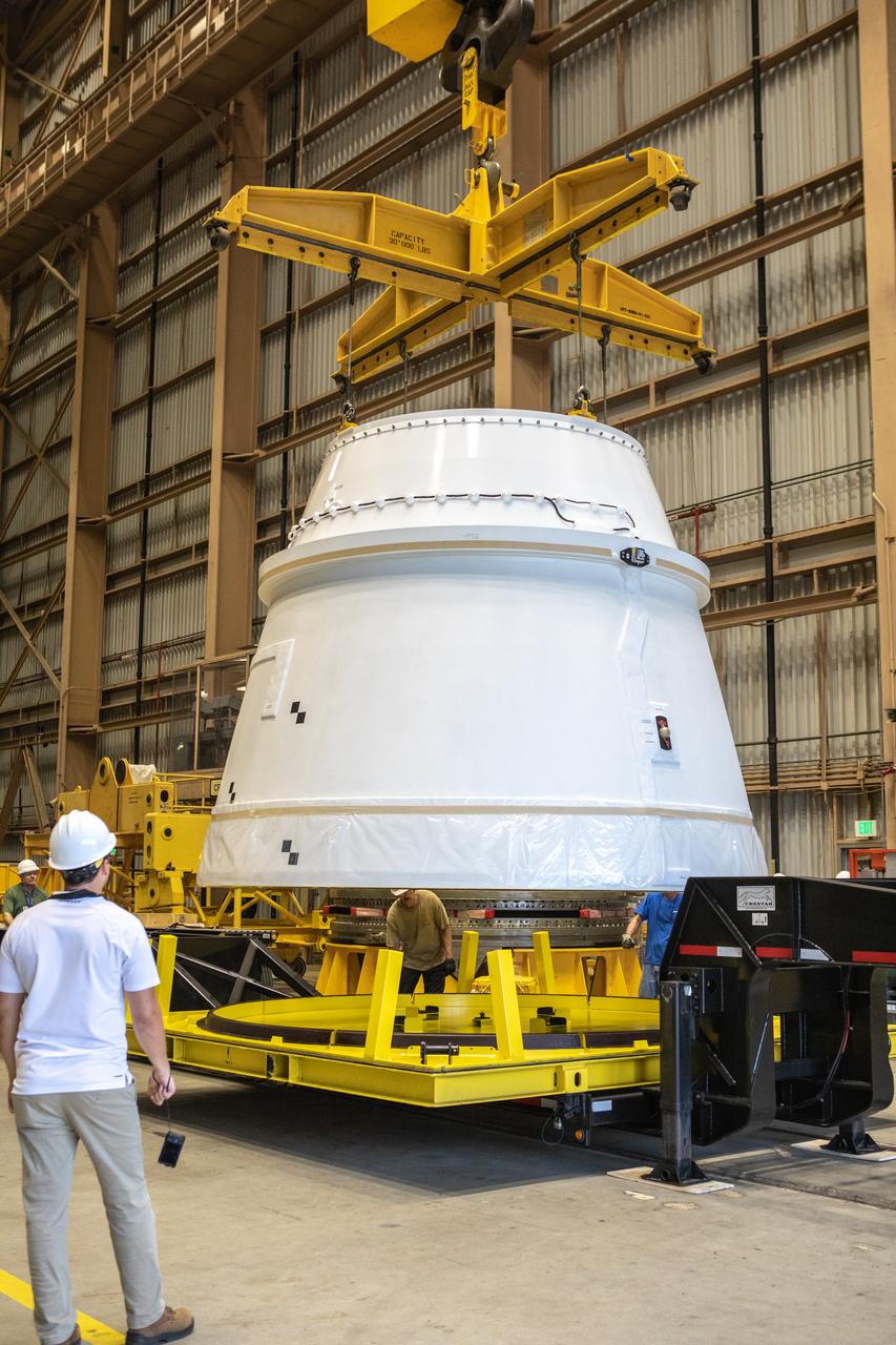 A crane is used to lift the first Northrop Grumman aft exit cone to arrive for the Space Launch System’s solid rocket boosters away from its shipping base inside the Rotation, Processing and Surge Facility at NASA’s Kennedy Space Center in Florida on Nov. 4, 2019. The aft exit cone was shipped from Promontory, Utah. It will be checked out and prepared for the Artemis I uncrewed test flight. The aft exit cones sit at the bottommost part of the twin boosters. They are attached to the aft skirts, which contain the booster separation motors. The exit cones help to protect the aft skirts during launch.