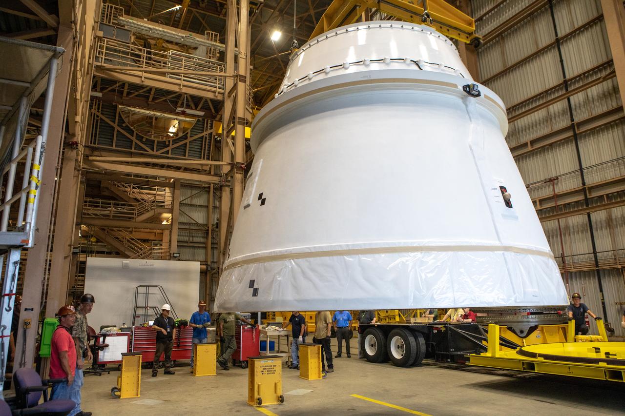 The first Northrop Grumman aft exit cone to arrive for the Space Launch System’s solid rocket boosters is moved by crane inside the Rotation, Processing and Surge Facility at NASA’s Kennedy Space Center in Florida on Nov. 4, 2019. The aft exit cone was shipped from Promontory, Utah. It will be checked out and prepared for the Artemis I uncrewed test flight. The aft exit cones sit at the bottommost part of the twin boosters. They are attached to the aft skirts, which contain the booster separation motors. The exit cones help to protect the aft skirts during launch.
