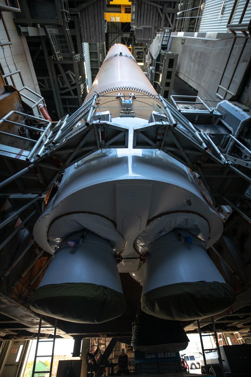 Two solid rocket boosters are mated to a United Launch Alliance Atlas V first stage inside the Vertical Integration Facility at Space Launch Complex 41 at Cape Canaveral Air Force Station in Florida on Nov. 7, 2019, in preparation for Boeing’s Orbital Flight Test (OFT). The uncrewed OFT mission will rendezvous and dock Boeing’s CST-100 Starliner spacecraft with the International Space Station as part of NASA’s Commercial Crew Program. Starliner will launch atop the Atlas V rocket from Space Launch Complex 41.
