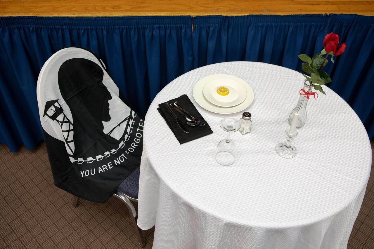 A prisoner of war (POW), missing in action (MIA) table is on display in the Training Auditorium at NASA’s Kennedy Space Center in Florida during a Veterans Day observance event on Nov. 7, 2019. The event began with a POW MIA ceremony, followed by an awards recognition, naming Kennedy a Purple Heart Entity by the Military Order of the Purple Heart. Kennedy is the first NASA center to receive this designation for support and services provided to veterans through the spaceport’s Veterans employee resource group. Attendees included Kennedy employees and more than 20 Purple Heart recipients. Following the award presentation, Christopher Vedvick, a combat wounded veteran and Military Order of the Purple Heart department of Florida commander, spoke about his experience serving in the United States Army before retiring, his involvement in the Military Order of the Purple Heart and the purpose of the organization. 
