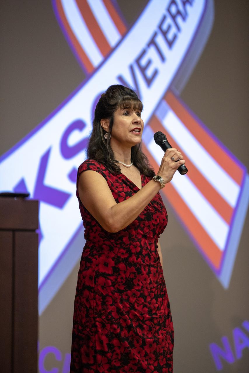 The National Anthem is sung by Suzy Cunningham, NASA Strategy and Integration manager, during a Veterans Day observance ceremony held in the Kennedy Space Center’s Training Auditorium in Florida on Nov. 7, 2019. During the event, Kennedy was named a Purple Heart Entity by the Military Order of the Purple Heart, becoming the first NASA center to receive this designation for support and services provided to veterans through the spaceport’s Veterans employee resource group. Attendees included Kennedy employees and more than 20 Purple Heart recipients. Following the award presentation, Christopher Vedvick, a combat wounded veteran and Military Order of the Purple Heart department of Florida commander, spoke about his experience serving in the United States Army before retiring, his involvement in the Military Order of the Purple Heart and the purpose of the organization.